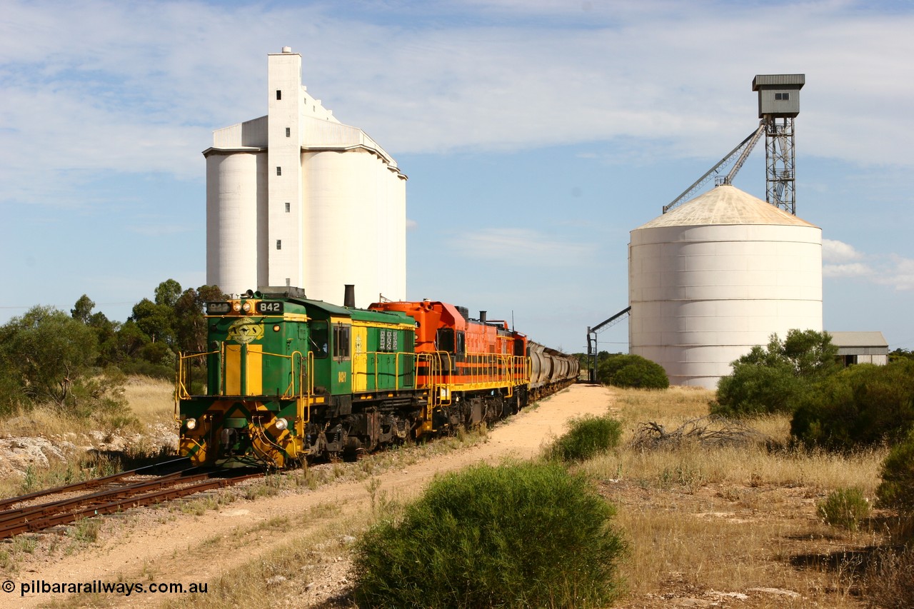 060109 2123
Kyancutta, ASR 830 class unit 842, an AE Goodwin built ALCo DL531 model loco serial 84140 leads EMD unit 1204 due to air-conditioning trouble and sister ALCo 851 as they shunt empty grain waggons on the silo loop. 9th January 2006.
Keywords: 830-class;842;AE-Goodwin;ALCo;DL531;84140;