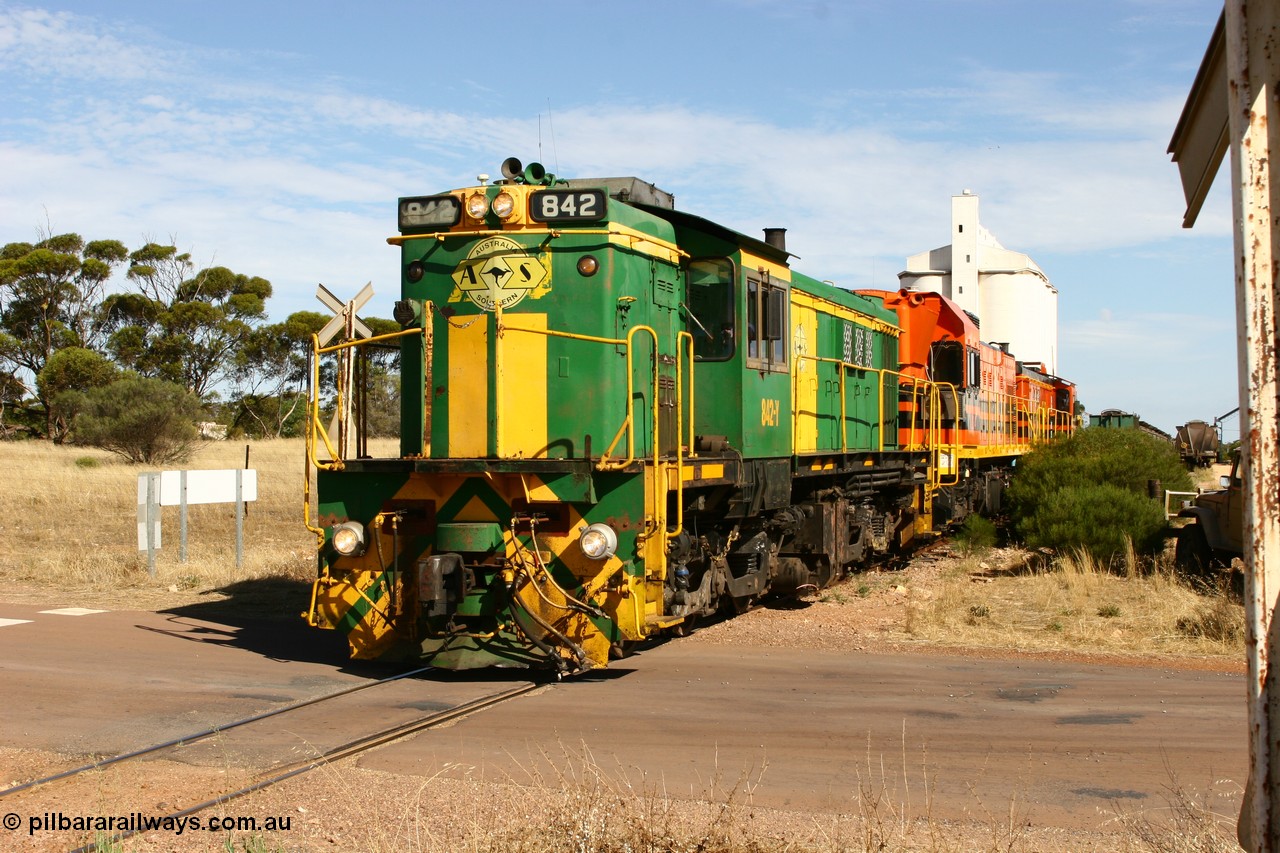 060109 2128
Kyancutta, ASR 830 class unit 842, an AE Goodwin built ALCo DL531 model loco serial 84140 leads EMD unit 1204 due to air-conditioning trouble and sister ALCo 851 as they shunt across Museum Terrace to re-join the train on the mainline. 9th January 2006.
Keywords: 830-class;842;AE-Goodwin;ALCo;DL531;84140;