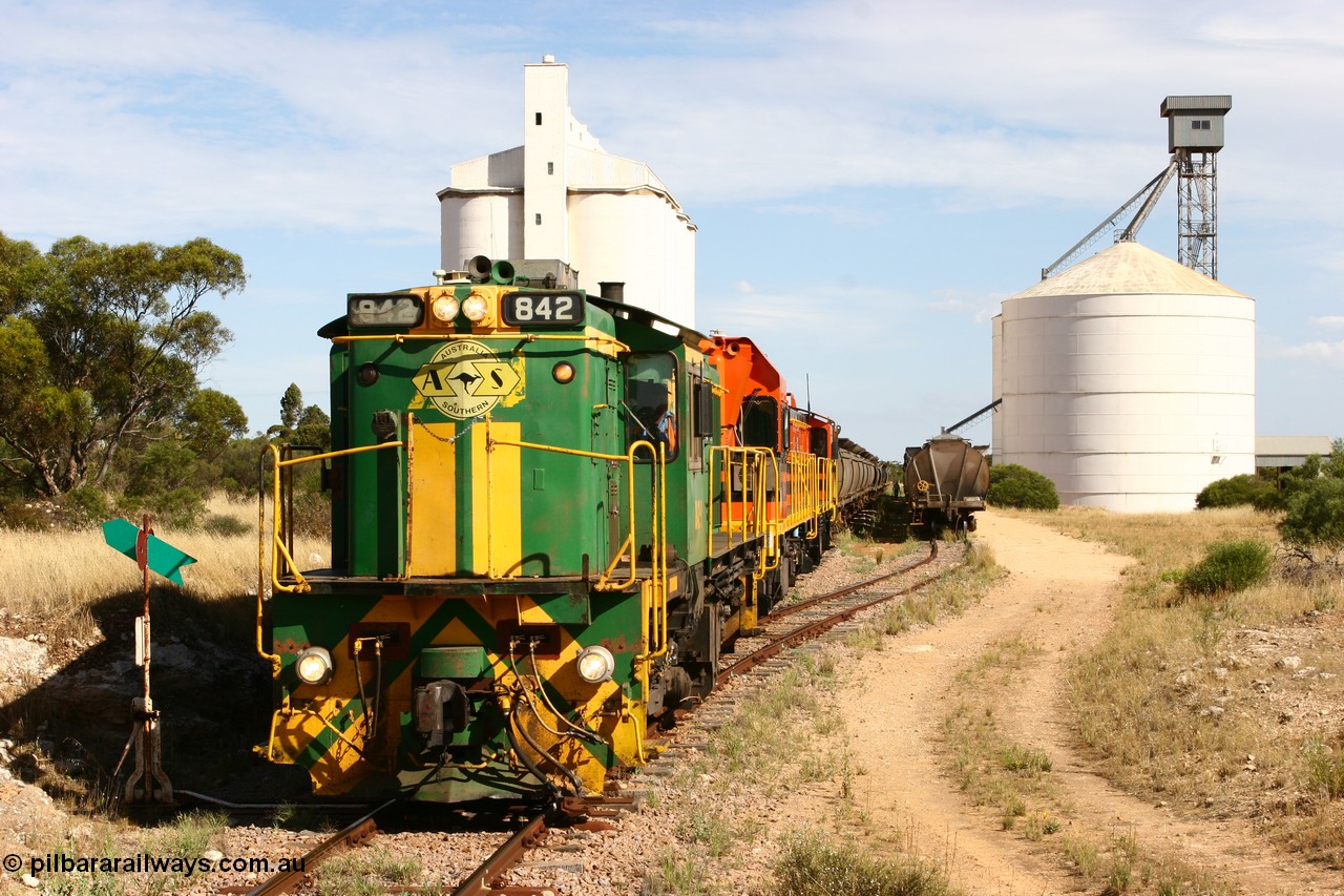 060109 2131
Kyancutta, ASR 830 class unit 842, an AE Goodwin built ALCo DL531 model loco serial 84140 leads EMD unit 1204 due to air-conditioning trouble and sister ALCo 851 as they re-join the train on the mainline. 9th January 2006.
Keywords: 830-class;842;AE-Goodwin;ALCo;DL531;84140;