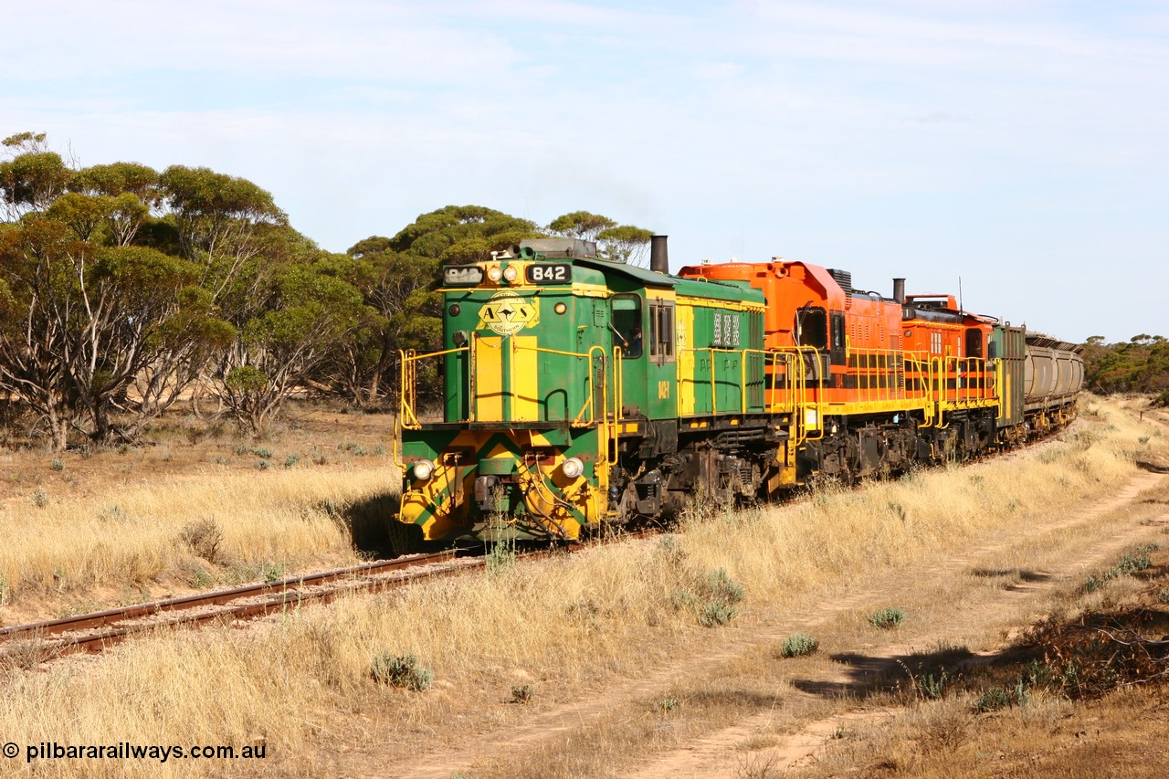 060109 2140
Wannamana, [url=https://goo.gl/maps/43EOs]on the curve[/url] 2 km north of the former station site empty train lead by ASR 830 class unit 842, an AE Goodwin built ALCo DL531 model loco serial 84140 with an EMD 1200 class and a sister ALCo unit. 9th January 2006.
Keywords: 830-class;842;AE-Goodwin;ALCo;DL531;84140;