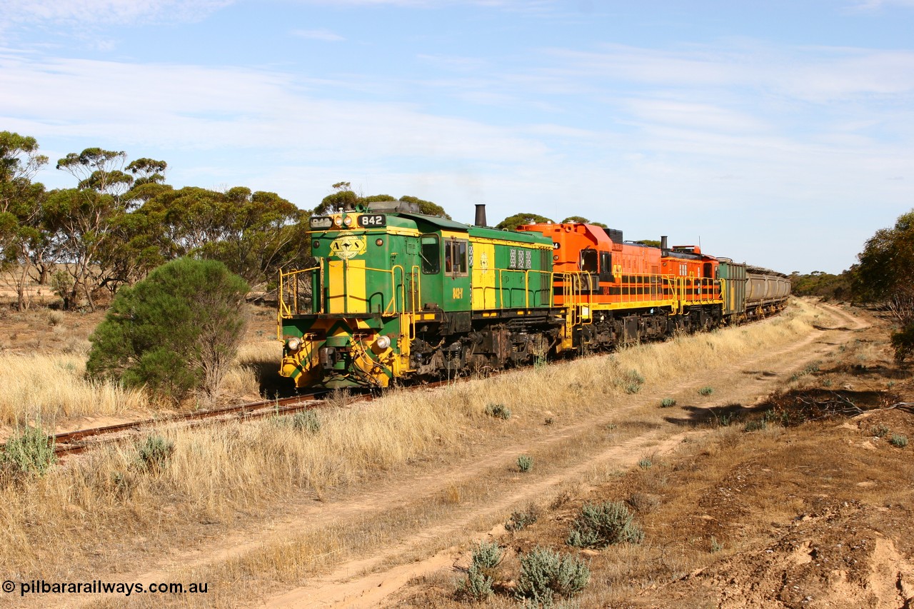 060109 2141
Wannamana, [url=https://goo.gl/maps/43EOs]on the curve[/url] 2 km north of the former station site empty train lead by ASR 830 class unit 842, an AE Goodwin built ALCo DL531 model loco serial 84140 with an EMD 1200 class and a sister ALCo unit. 9th January 2006.
Keywords: 830-class;842;AE-Goodwin;ALCo;DL531;84140;