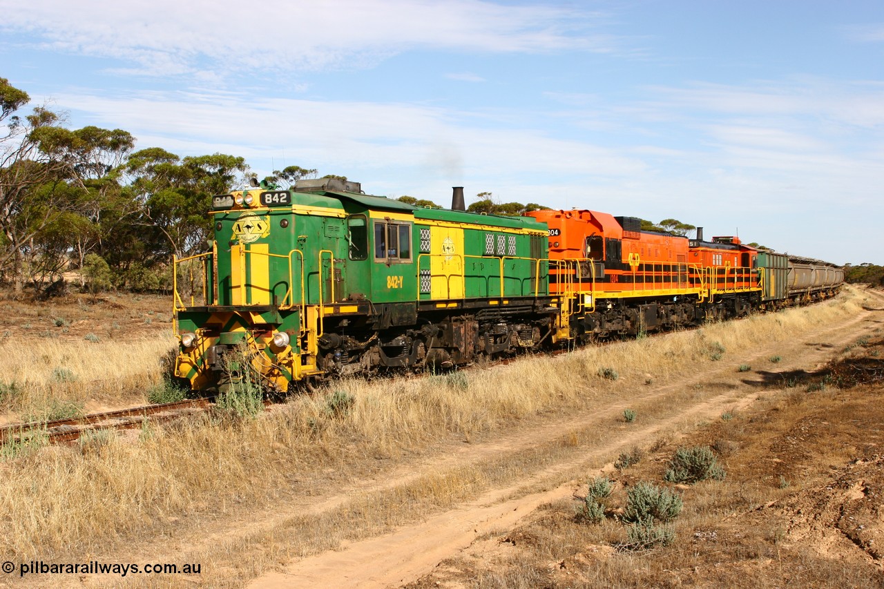 060109 2143
Wannamana, [url=https://goo.gl/maps/43EOs]on the curve[/url] 2 km north of the former station site empty train lead by ASR 830 class unit 842, an AE Goodwin built ALCo DL531 model loco serial 84140 with an EMD 1200 class and a sister ALCo unit. 9th January 2006.
Keywords: 830-class;842;AE-Goodwin;ALCo;DL531;84140;