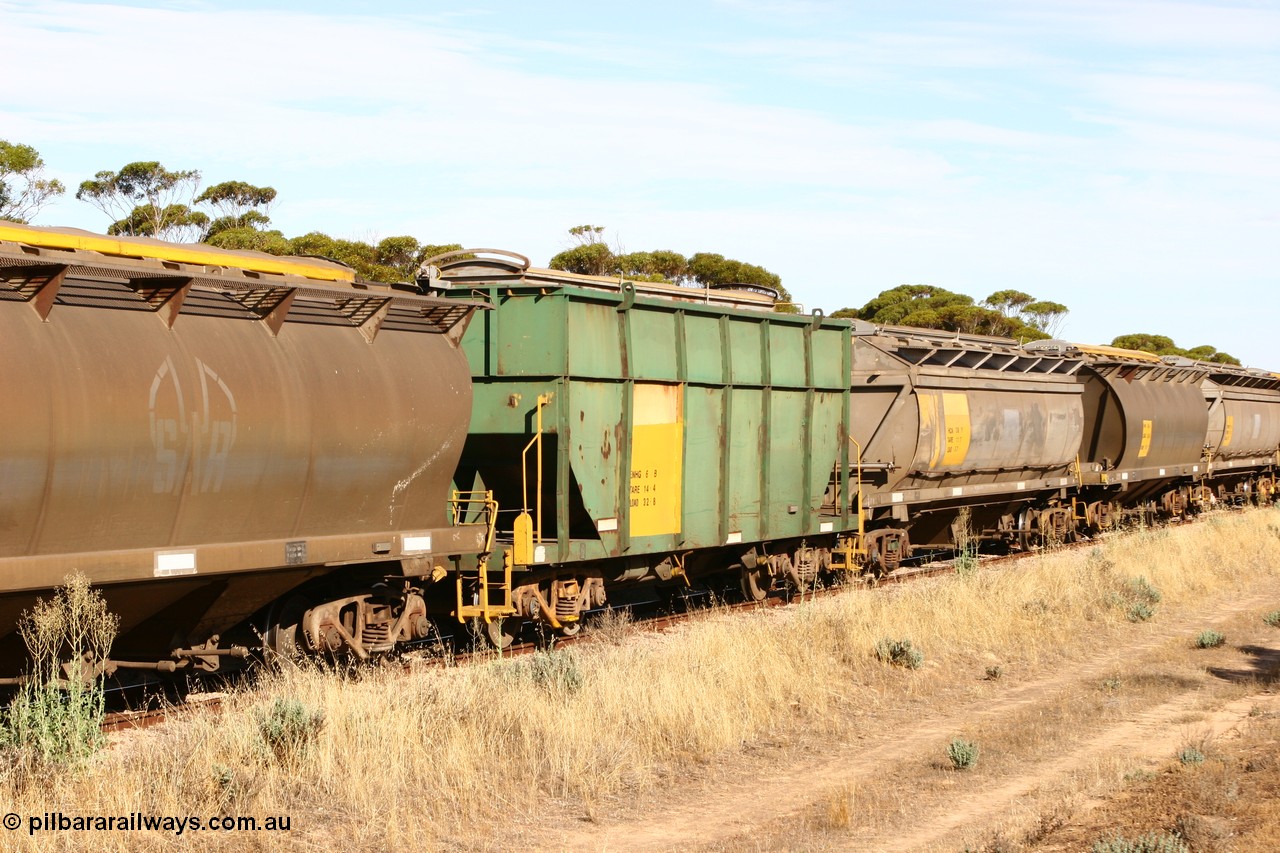 060109 2147
Wannamana, former Australian National narrow gauge ENHG type bogie grain waggon ENHG 6, originally built by Moore Road Ind, Victoria as NB type NB 1444 ballast hopper for the NAR, then to standard gauge in 1975 as BA type BA 1536, to EP July 1984, recoded to ENHT type ENHT 11 in 1985 and further rebuilt forming one half of ENHG type grain waggon in August 1986. The conversion involved splicing 2 AHTY-ENHT type waggons together at Port Lincoln workshops, roll top cover visible, part of an empty train [url=https://goo.gl/maps/43EOs]on the curve[/url]. 9th January 2006.
Keywords: ENHG-type;ENHG6;Moore-Road-Ind-Victoria;NB-type;NB1444;BA-type;BA1536;ENHT-type;ENHT11;