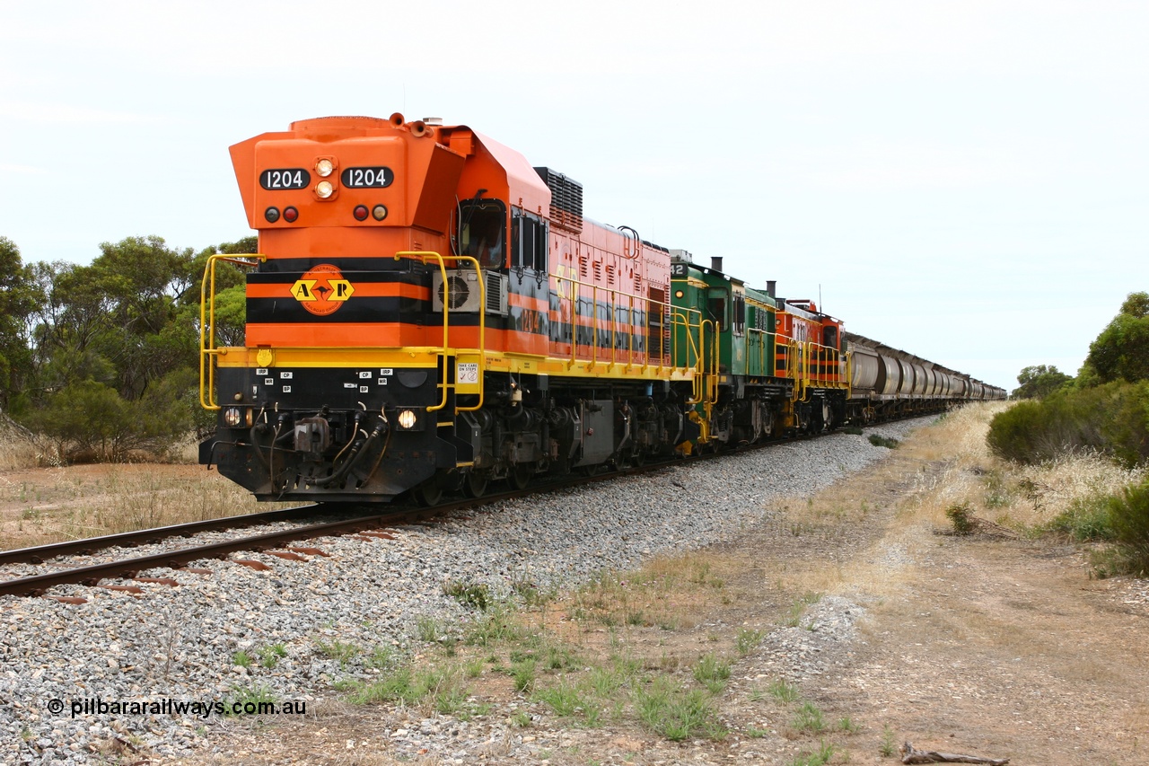 060110 2153
Pillana, former station site, 59 km, empty grain train behind ARG 1200 class unit 1204, a Clyde Engineering EMD model G12C serial 65-428, originally built for the WAGR as the final unit of fourteen A class locomotives in 1965 then sent to the Eyre Peninsula in July 2004, and two 830 class AE Goodwin built ALCo model DL531 units 842 serial 84140 ex SAR broad gauge to Eyre Peninsula in October 1987, and 851 serial 84137 new to Eyre Peninsula in 1962. [url=https://goo.gl/maps/BcnmpGwGqtw]Approx. location of photo[/url].
Keywords: 1200-class;1204;Clyde-Engineering-Granville-NSW;EMD;G12C;65-428;A-class;A1514;830-class;842;851;AE-Goodwin;ALCo;DL531;84137;84140;