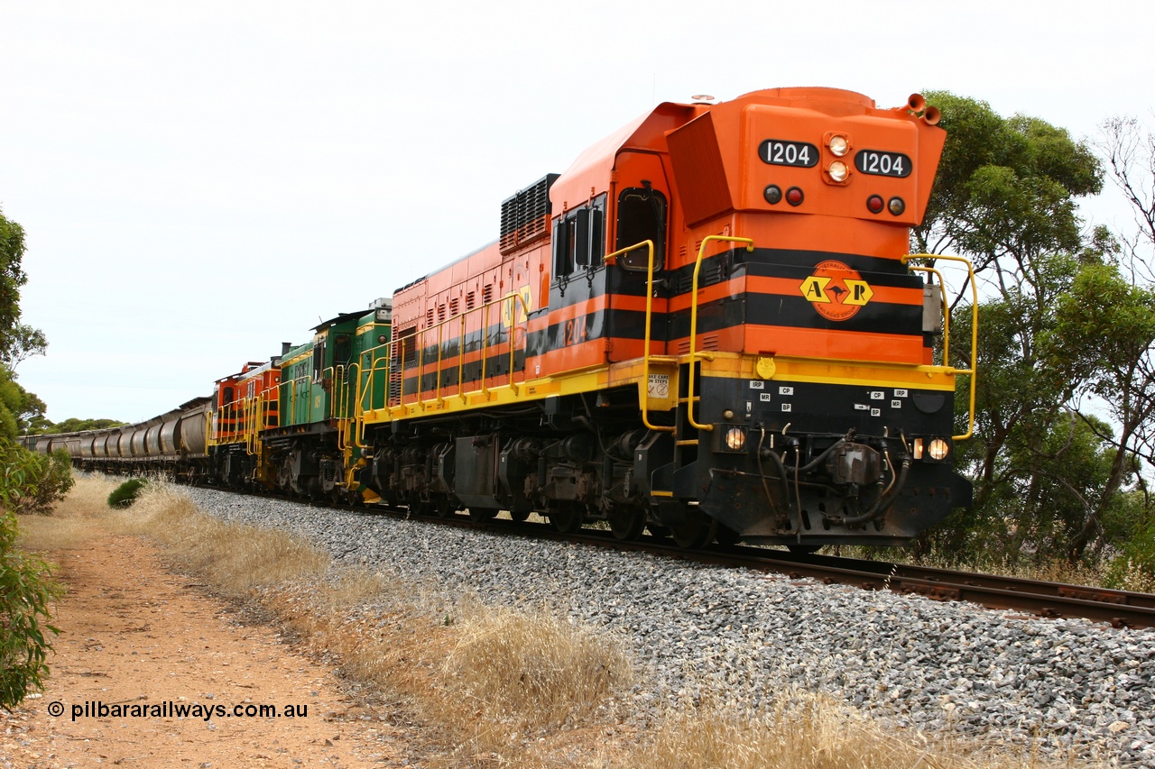 060110 2160
Near the 64 km between Pillana and Cummins, empty grain train behind ARG 1200 class unit 1204, a Clyde Engineering EMD model G12C serial 65-428, originally built for the WAGR as the final unit of fourteen A class locomotives in 1965 then sent to the Eyre Peninsula in July 2004, and two 830 class AE Goodwin built ALCo model DL531 units 842 serial 84140 ex SAR broad gauge to Eyre Peninsula in October 1987, and 851 serial 84137 new to Eyre Peninsula in 1962. [url=https://goo.gl/maps/NECDZnDkLfv]Approx. location of photo[/url].
Keywords: 1200-class;1204;Clyde-Engineering-Granville-NSW;EMD;G12C;65-428;A-class;A1514;830-class;842;851;AE-Goodwin;ALCo;DL531;84137;84140;