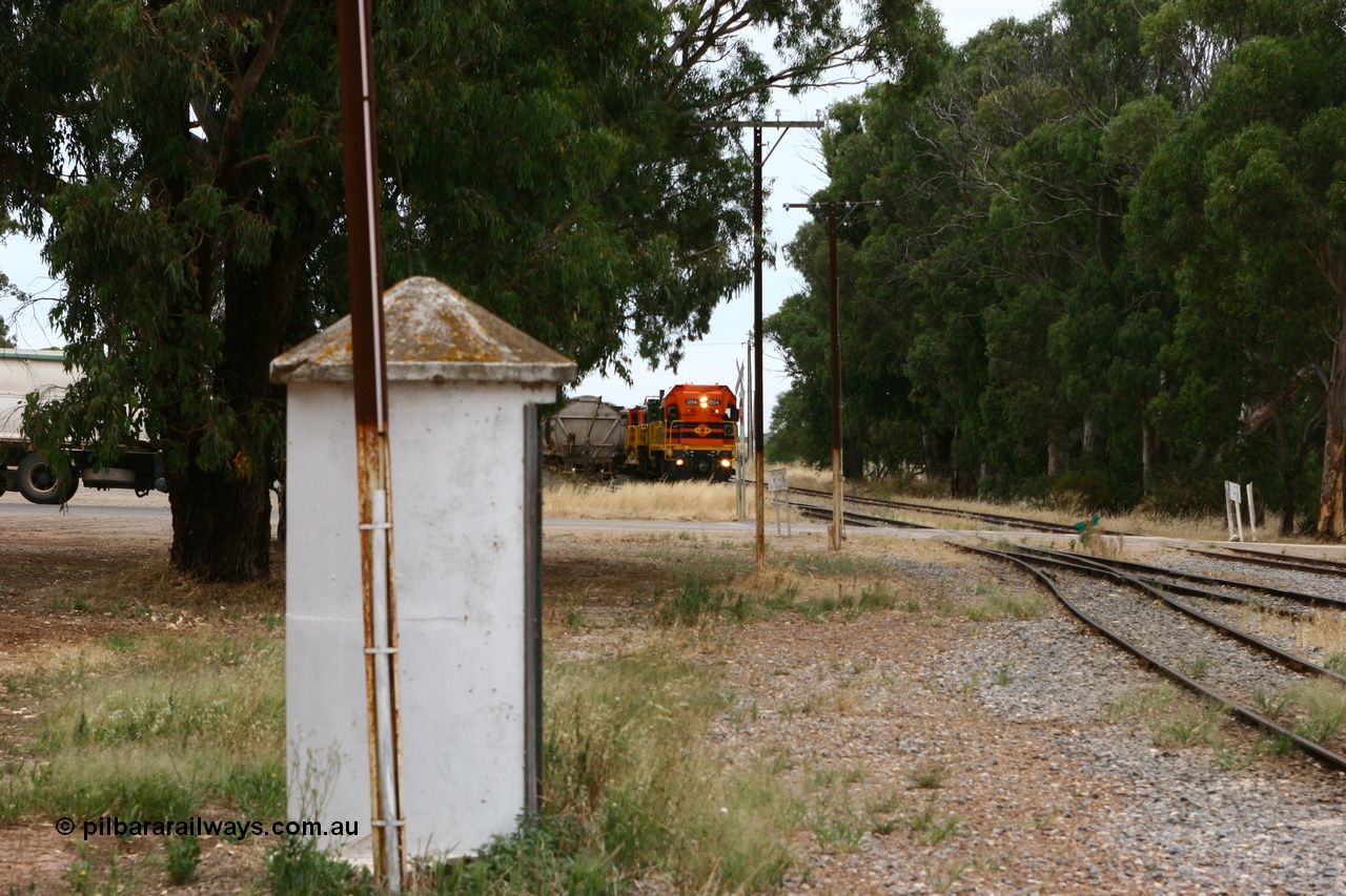060110 2162
Cummins, view across Railway Terrace of empty grain train on the mainline to shunt the Cummins Bunker track to pick up the rake on the left, behind ARG 1200 class unit 1204, a Clyde Engineering EMD model G12C serial 65-428, originally built for the WAGR as the final unit of fourteen A class locomotives in 1965. Sent to the Eyre Peninsula in July 2004. [url=https://goo.gl/maps/q5aVqSmjCP62]Approx. location of image[/url].
Keywords: 1200-class;1204;Clyde-Engineering-Granville-NSW;EMD;G12C;65-428;A-class;A1514;