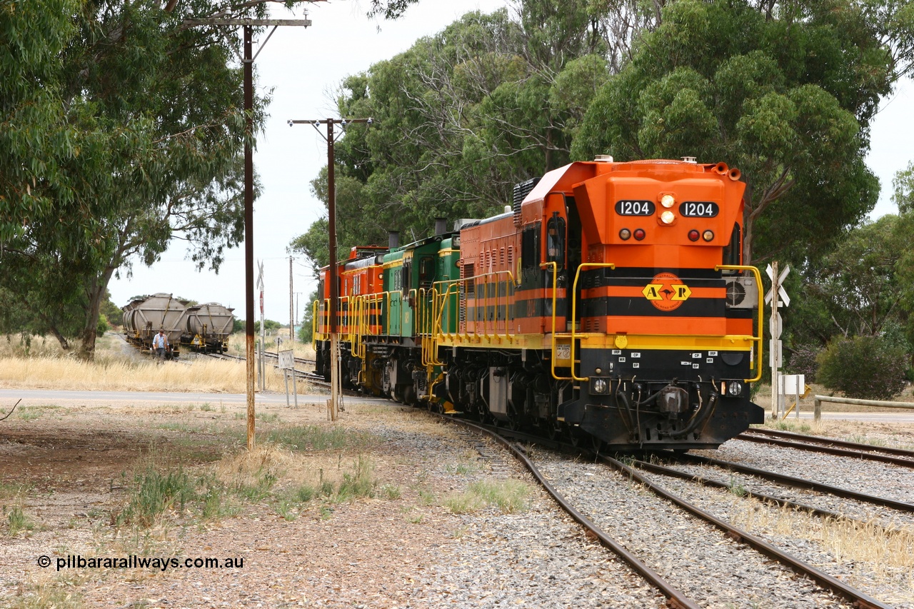060110 2164
Cummins, view across Railway Terrace of empty grain train shunting the Cummins Bunker track to pick up empty hoppers, behind ARG 1200 class unit 1204, a Clyde Engineering EMD model G12C serial 65-428, originally built for the WAGR as the final unit of fourteen A class locomotives in 1965 and sent to the Eyre Peninsula in July 2004 and two 830 class AE Goodwin built ALCo model DL531 units 842 serial 84140 ex SAR broad gauge to Eyre Peninsula in October 1987, and 851 serial 84137 new to Eyre Peninsula in 1962. [url=https://goo.gl/maps/q5aVqSmjCP62]Approx. location of image[/url].
Keywords: 1200-class;1204;Clyde-Engineering-Granville-NSW;EMD;G12C;65-428;A-class;A1514;830-class;842;851;AE-Goodwin;ALCo;DL531;84137;84140;