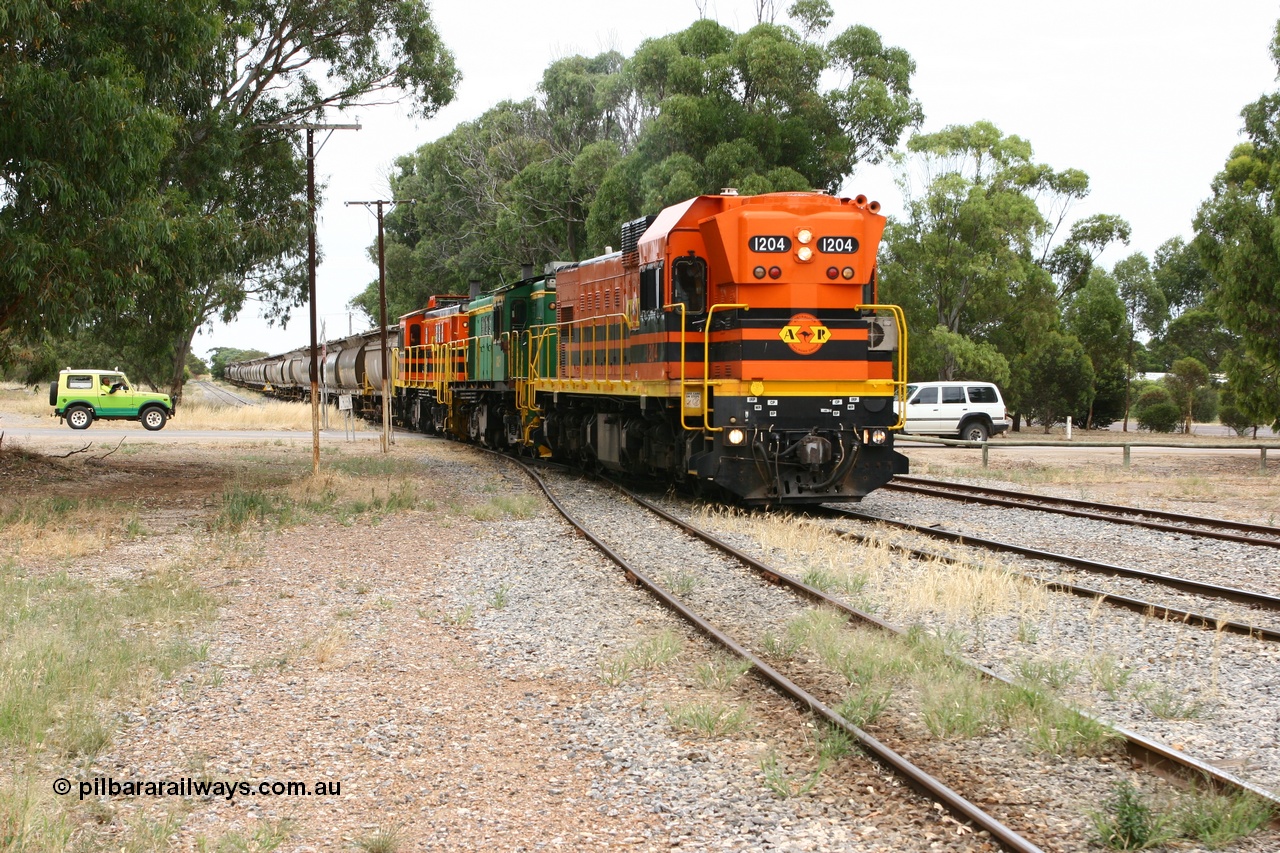 060110 2166
Cummins, view across Railway Terrace of empty grain train runs into the yard along the mainline having completed its' shunt behind ARG 1200 class unit 1204, a Clyde Engineering EMD model G12C serial 65-428, originally built for the WAGR as the final unit of fourteen A class locomotives in 1965 and sent to the Eyre Peninsula in July 2004 and two 830 class AE Goodwin built ALCo model DL531 units 842 serial 84140 ex SAR broad gauge to Eyre Peninsula in October 1987, and 851 serial 84137 new to Eyre Peninsula in 1962. [url=https://goo.gl/maps/q5aVqSmjCP62]Approx. location of image[/url].
Keywords: 1200-class;1204;Clyde-Engineering-Granville-NSW;EMD;G12C;65-428;A-class;A1514;830-class;842;851;AE-Goodwin;ALCo;DL531;84137;84140;