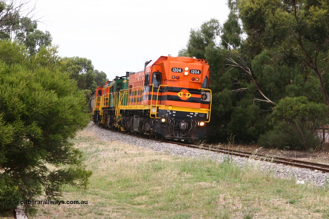 060110 2171
Cummins, empty grain train departing yard on the Penong mainline behind ARG 1200 class unit 1204, a Clyde Engineering EMD model G12C serial 65-428, originally built for the WAGR as the final unit of fourteen A class locomotives in 1965 and sent to the Eyre Peninsula in July 2004 and two 830 class AE Goodwin built ALCo model DL531 units 842 serial 84140 ex SAR broad gauge to Eyre Peninsula in October 1987, and 851 serial 84137 new to Eyre Peninsula in 1962. [url=https://goo.gl/maps/cL7ZN9y12t92]Approx. location of image[/url].
Keywords: 1200-class;1204;Clyde-Engineering-Granville-NSW;EMD;G12C;65-428;A-class;A1514;830-class;842;851;AE-Goodwin;ALCo;DL531;84137;84140;