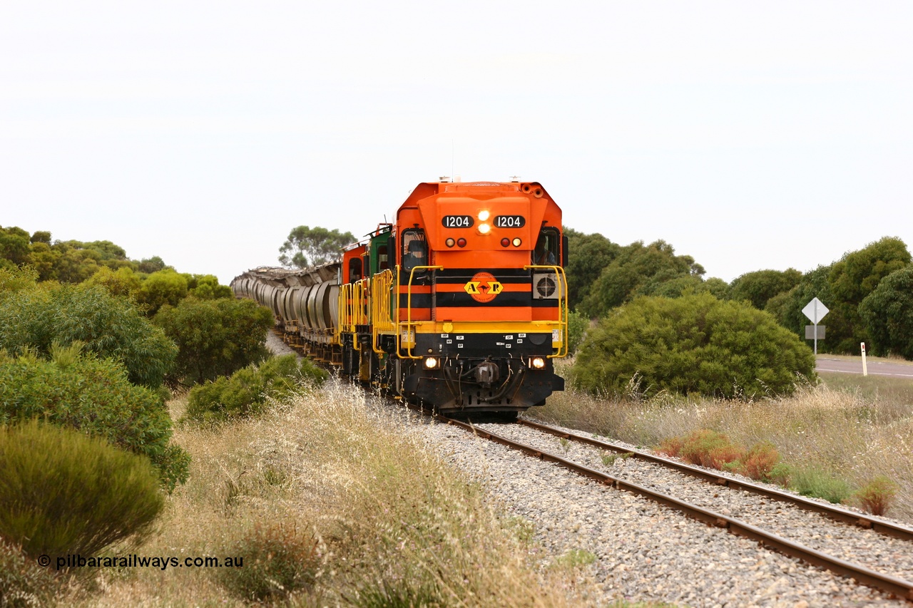 060110 2177
Near the 73 km and Cockaleechie Road grade crossing, empty grain train with ARG 1200 class unit 1204, a Clyde Engineering EMD model G12C serial 65-428, originally built for the WAGR as the final unit of fourteen A class locomotives in 1965 and sent to the Eyre Peninsula in July 2004 and two 830 class AE Goodwin built ALCo model DL531 units 842 serial 84140 ex SAR broad gauge to Eyre Peninsula in October 1987, and 851 serial 84137 new to Eyre Peninsula in 1962. [url=https://goo.gl/maps/LoznGHgHTUC2]Approx. location of image[/url].
Keywords: 1200-class;1204;Clyde-Engineering-Granville-NSW;EMD;G12C;65-428;A-class;A1514;830-class;842;851;AE-Goodwin;ALCo;DL531;84137;84140;