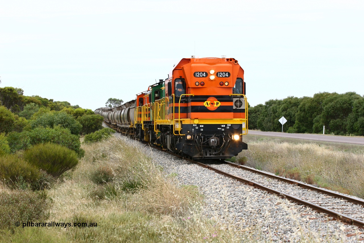 060110 2179
Near the 73 km and Cockaleechie Road grade crossing, empty grain train with ARG 1200 class unit 1204, a Clyde Engineering EMD model G12C serial 65-428, originally built for the WAGR as the final unit of fourteen A class locomotives in 1965 and sent to the Eyre Peninsula in July 2004 and two 830 class AE Goodwin built ALCo model DL531 units 842 serial 84140 ex SAR broad gauge to Eyre Peninsula in October 1987, and 851 serial 84137 new to Eyre Peninsula in 1962. [url=https://goo.gl/maps/LoznGHgHTUC2]Approx. location of image[/url].
Keywords: 1200-class;1204;Clyde-Engineering-Granville-NSW;EMD;G12C;65-428;A-class;A1514;830-class;842;851;AE-Goodwin;ALCo;DL531;84137;84140;