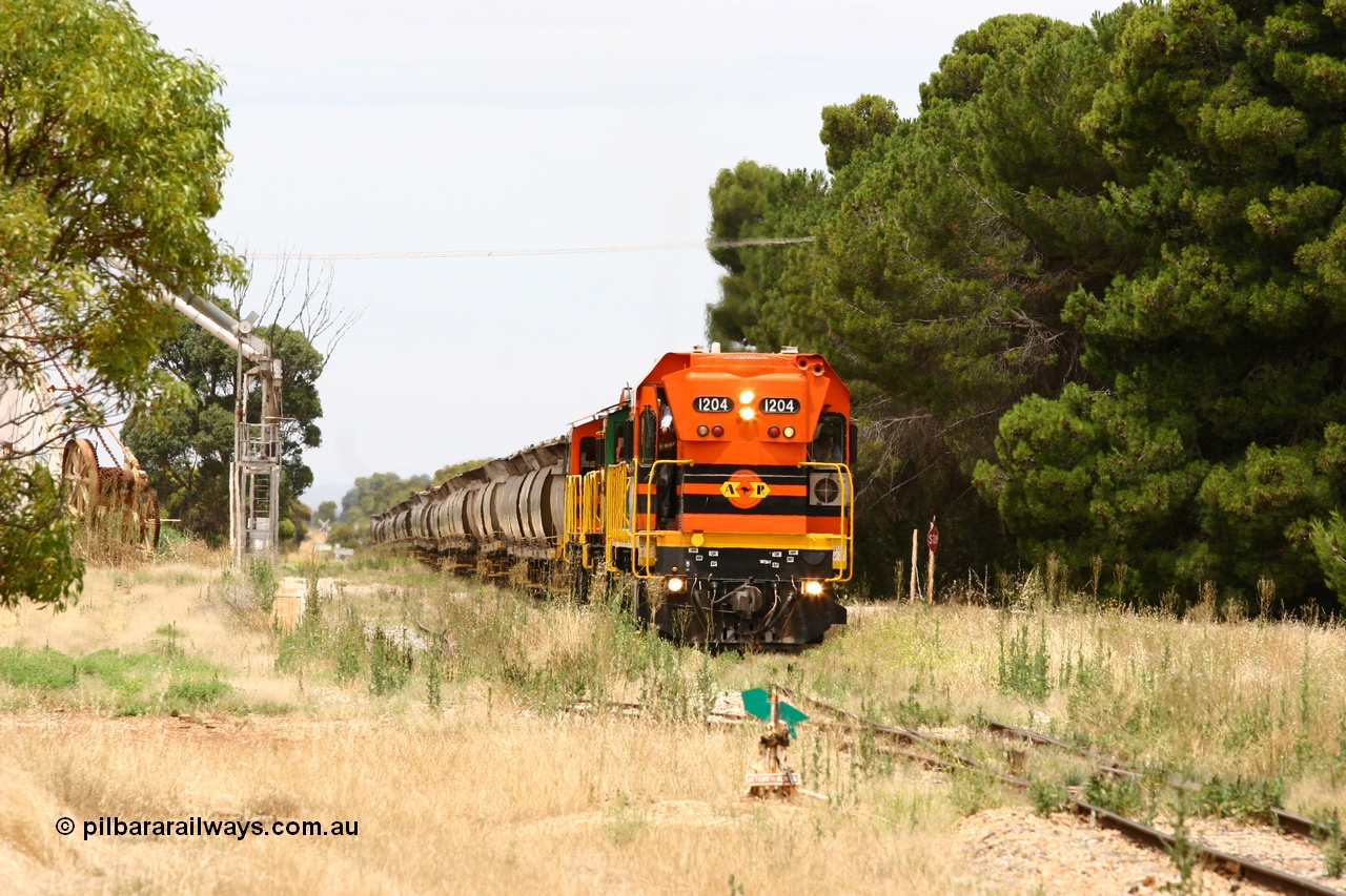 060110 2188
Yeelanna, empty grain arriving to shunt off empty hoppers as the second person exits the cab of ARG 1200 class unit 1204, a Clyde Engineering EMD model G12C serial 65-428, originally built for the WAGR as the final unit of fourteen A class locomotives in 1965. Sent to the Eyre Peninsula in July 2004. [url=https://goo.gl/maps/1JetzWBTGAw]Approx. location of image[/url].
Keywords: 1200-class;1204;Clyde-Engineering-Granville-NSW;EMD;G12C;65-428;A-class;A1514;