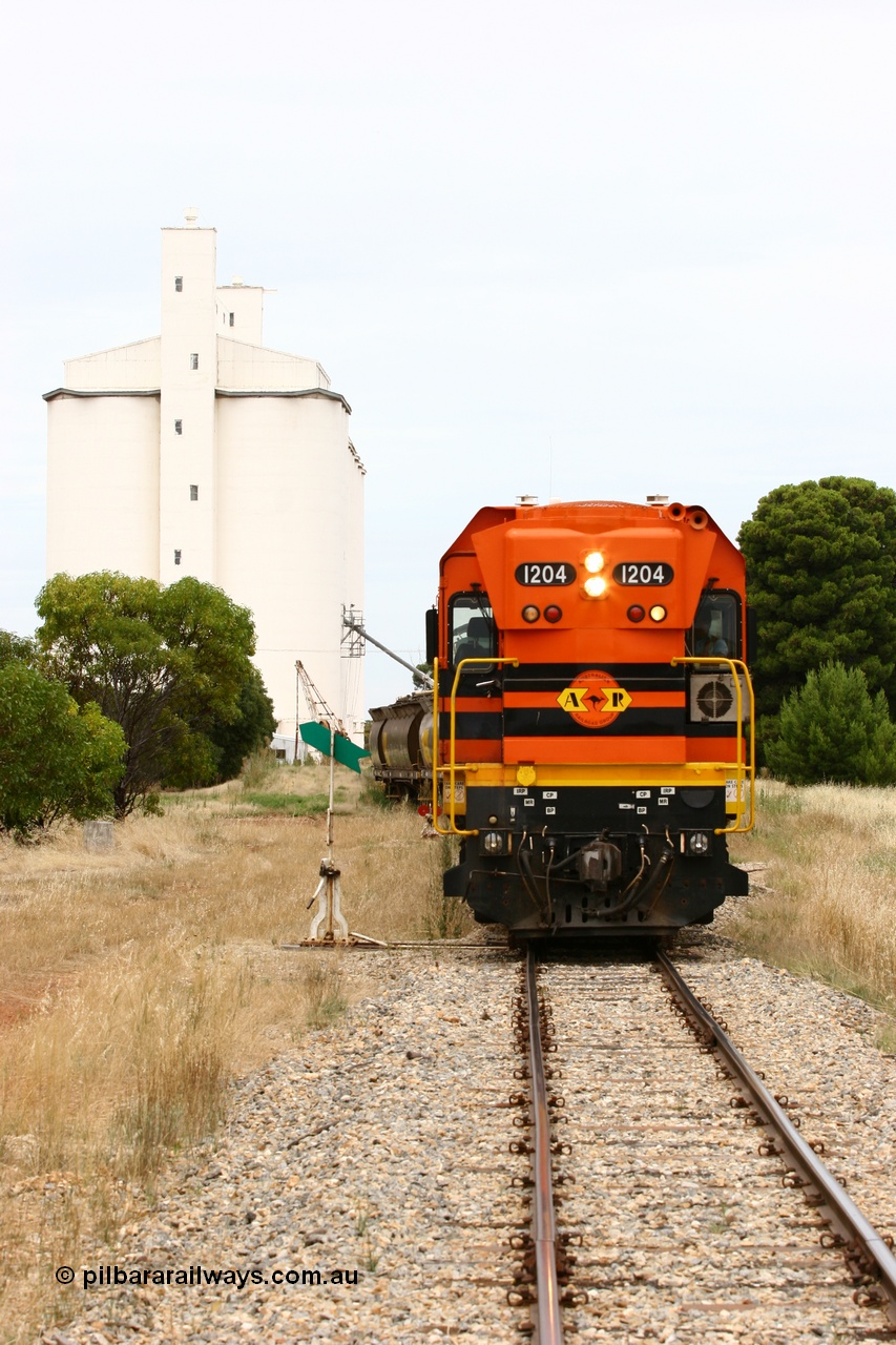 060110 2198
Yeelanna, ARG 1200 class unit 1204, a Clyde Engineering EMD model G12C serial 65-428, originally built for the WAGR as the final unit of fourteen A class locomotives in 1965 and sent to the Eyre Peninsula in July 2004 shunts a rake of waggons into the grain siding. [url=https://goo.gl/maps/1JetzWBTGAw]Approx. location of image[/url].
Keywords: 1200-class;1204;Clyde-Engineering-Granville-NSW;EMD;G12C;65-428;A-class;A1514;
