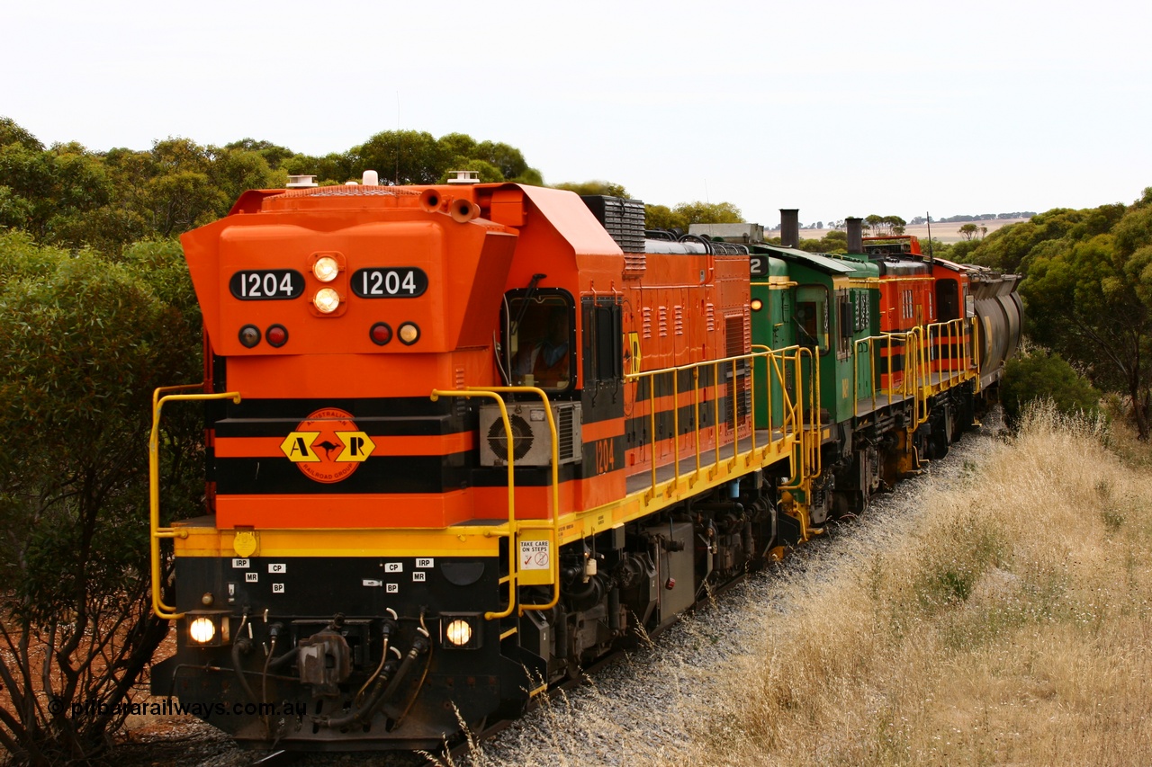060110 2215
On the curve near the 85 km between Yeelanna and Karkoo, ARG 1200 class unit 1204, a Clyde Engineering EMD model G12C serial 65-428, originally built for the WAGR as the final unit of fourteen A class locomotives in 1965 and sent to the Eyre Peninsula in July 2004 leads an empty grain train. [url=https://goo.gl/maps/7kwfXBE6nS12]Approx. location of image[/url].
Keywords: 1200-class;1204;Clyde-Engineering-Granville-NSW;EMD;G12C;65-428;A-class;A1514;830-class;842;851;AE-Goodwin;ALCo;DL531;84137;84140;