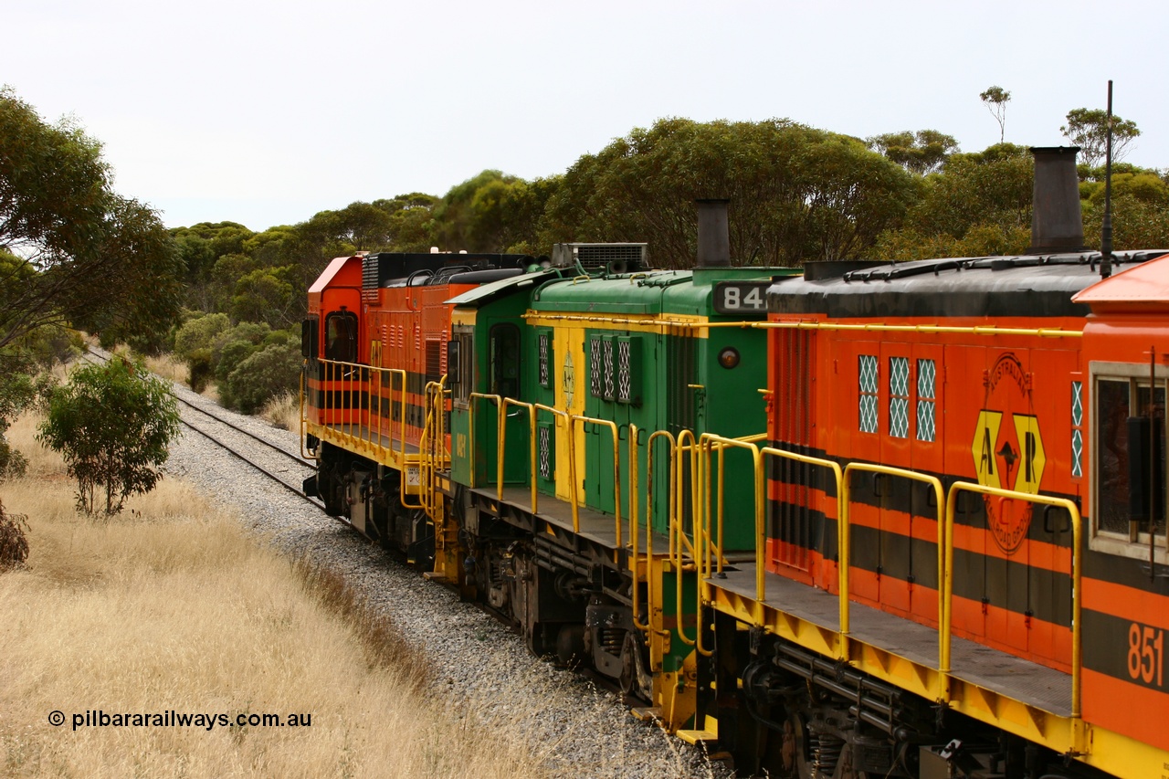 060110 2216
On the curve near the 85 km between Yeelanna and Karkoo, trailing view of 830 class AE Goodwin built ALCo model DL531 unit 842 serial 84140, ex SAR broad gauge and to Eyre Peninsula in October 1987, and ARG 1200 class unit 1204, a Clyde Engineering EMD model G12C serial 65-428, originally built for the WAGR as the final unit of fourteen A class locomotives in 1965 and sent to the Eyre Peninsula in July 2004 leads an empty grain train. [url=https://goo.gl/maps/7kwfXBE6nS12]Approx. location of image[/url].
Keywords: 1200-class;1204;Clyde-Engineering-Granville-NSW;EMD;G12C;65-428;A-class;A1514;830-class;842;AE-Goodwin;ALCo;DL531;84137;