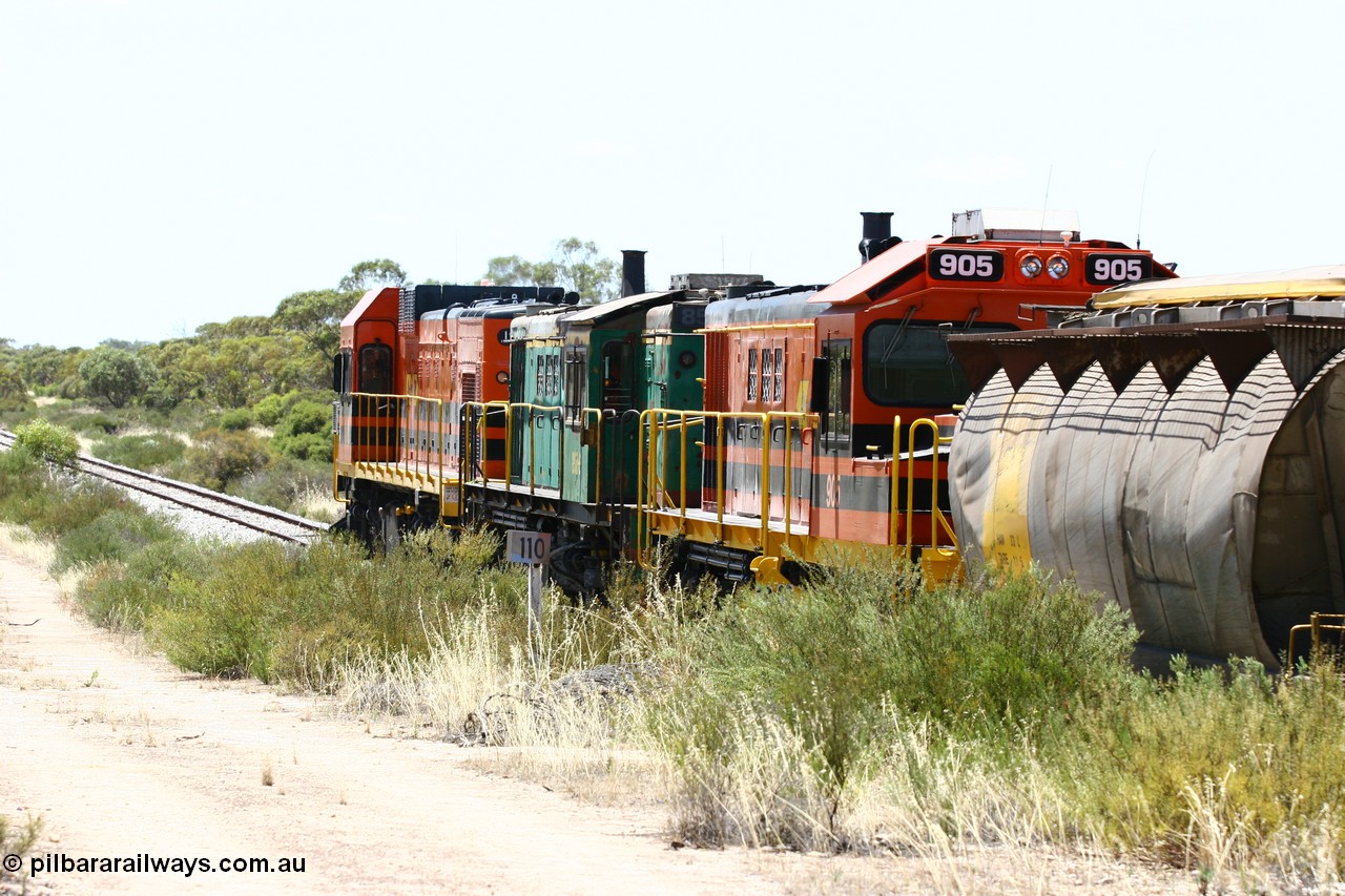 060111 2251
Tooligie, Mac's Road grade crossing at the 110 km, ARG 1200 class unit 1203, a Clyde Engineering EMD model G12C serial 65-427, one of fourteen originally built between 1960-65 for WAGR as their A class A 1513, fitted with dynamic brakes and financed by Western Mining Corporation, started working on the Eyre Peninsula in November 2004 leads an empty grain train north. 11th January 2006.
