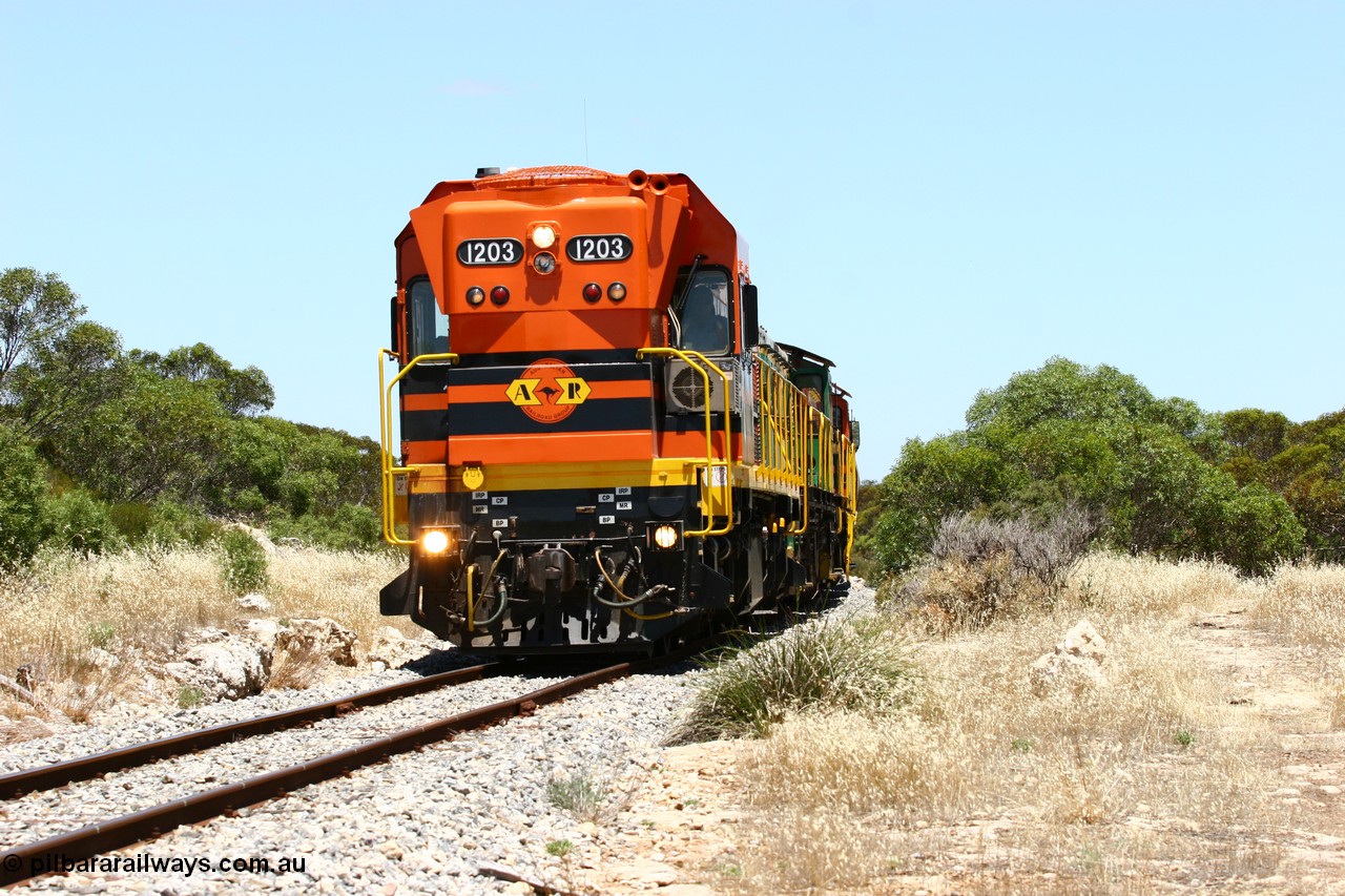 060111 2254
Tooligie, a kilometre south with empty grain train ARG 1200 class unit 1203, a Clyde Engineering EMD model G12C serial 65-427, one of fourteen originally built between 1960-65 for WAGR as their A class A 1513, fitted with dynamic brakes and financed by Western Mining Corporation, started working on the Eyre Peninsula in November 2004 leads an empty grain train north. 11th January 2006.
Keywords: 1200-class;1203;Clyde-Engineering-Granville-NSW;EMD;G12C;65-427;A-class;A1513;