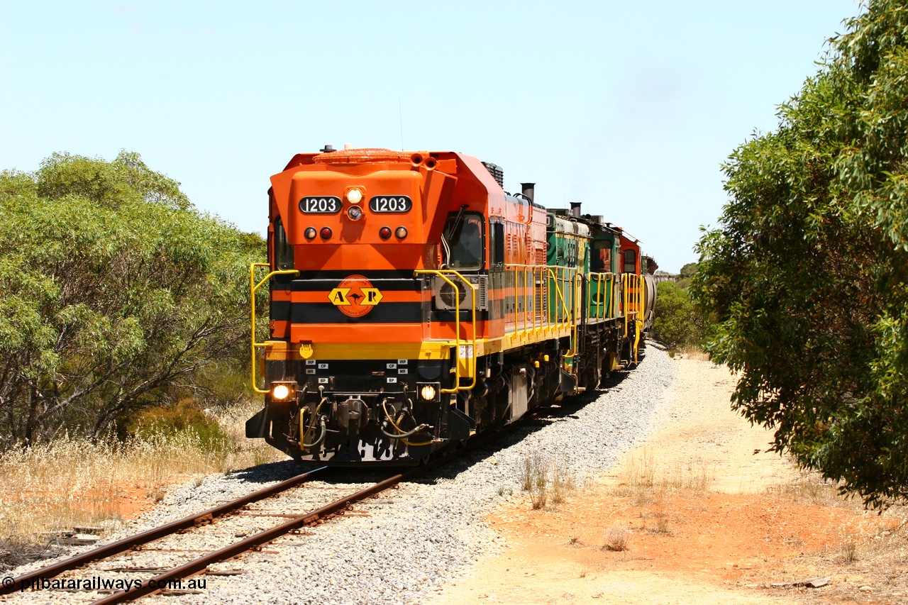 060111 2269
Tooligie, empty grain train running north behind ARG 1200 class unit 1203, a Clyde Engineering EMD model G12C serial 65-427, one of fourteen originally built between 1960-65 for WAGR as their A class A 1513, fitted with dynamic brakes and financed by Western Mining Corporation, started working on the Eyre Peninsula in November 2004. 11th January 2006.
Keywords: 1200-class;1203;Clyde-Engineering-Granville-NSW;EMD;G12C;65-427;A-class;A1513;