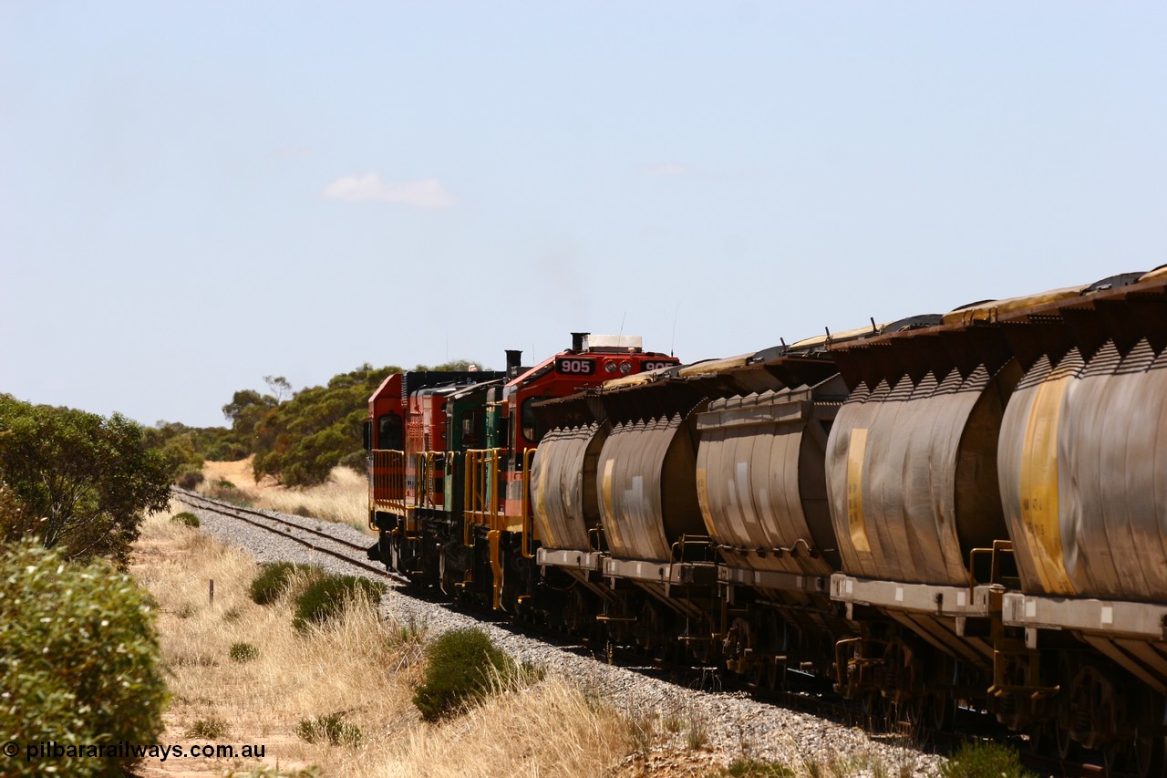 060111 2277
Peachna, Tooligie Hill Road grade crossing, empty grain train running north behind ARG 1200 class unit 1203, a Clyde Engineering EMD model G12C serial 65-427, one of fourteen originally built between 1960-65 for WAGR as their A class A 1513, fitted with dynamic brakes and financed by Western Mining Corporation, started working on the Eyre Peninsula in November 2004. 11th January 2006.
