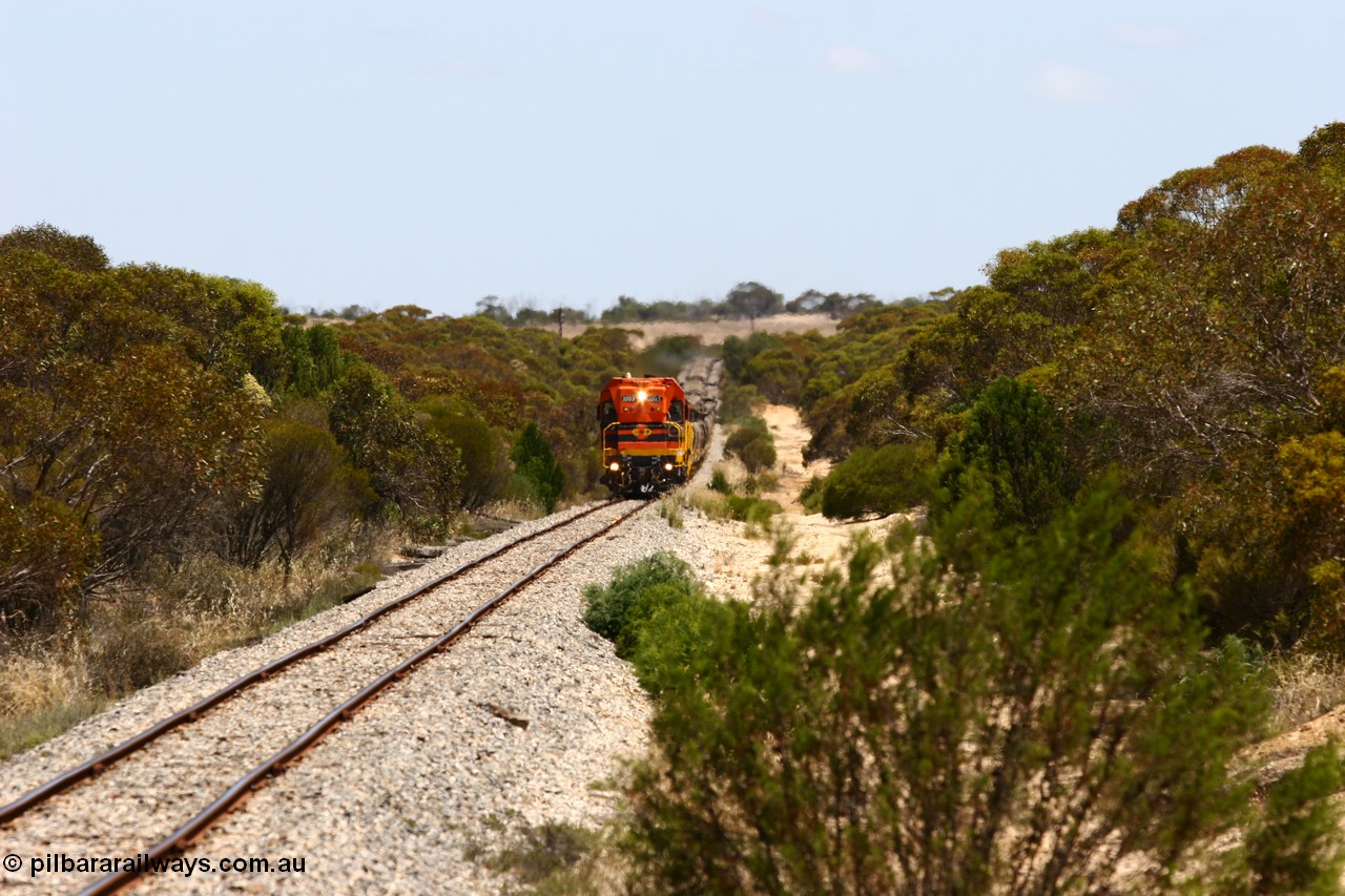 060111 2288
Warrachie, ARG 1200 class unit 1203, a Clyde Engineering EMD model G12C serial 65-427, one of fourteen originally built between 1960-65 for WAGR as their A class A 1513, fitted with dynamic brakes and financed by Western Mining Corporation, started working on the Eyre Peninsula in November 2004 leads an empty grain train between Murdinga and Lock. 11th January 2006.
Keywords: 1200-class;1203;Clyde-Engineering-Granville-NSW;EMD;G12C;65-427;A-class;A1513;