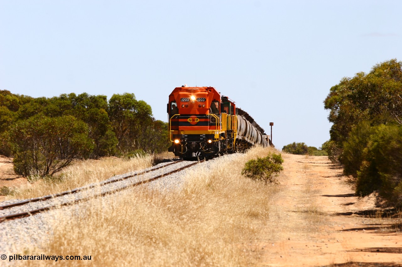 060111 2294
Lock, ARG 1200 class unit 1203, a Clyde Engineering EMD model G12C serial 65-427, one of fourteen originally built between 1960-65 for WAGR as their A class A 1513, fitted with dynamic brakes and financed by Western Mining Corporation, started working on the Eyre Peninsula in November 2004 with two ALCO units 850 and 905 drag their grain train over the grade past the location sign and down into Lock. 11th January 2006.
Keywords: 1200-class;1203;Clyde-Engineering-Granville-NSW;EMD;G12C;65-427;A-class;A1513;
