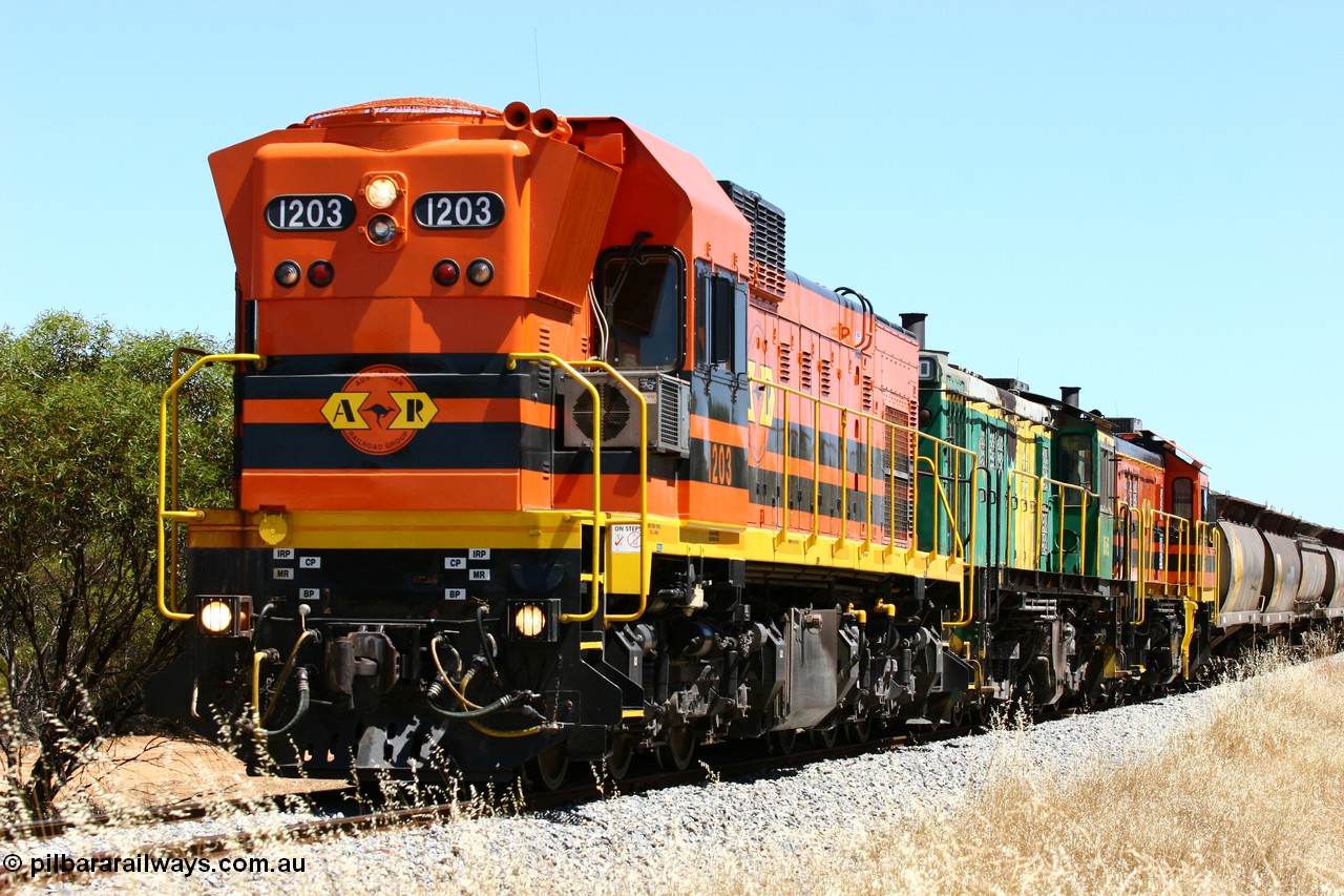 060111 2301
Lock, ARG 1200 class unit 1203, a Clyde Engineering EMD model G12C serial 65-427, one of fourteen originally built between 1960-65 for WAGR as their A class A 1513, fitted with dynamic brakes and financed by Western Mining Corporation, started working on the Eyre Peninsula in November 2004 with two ALCO units 850 and 905 drag their grain train over the grade past the location sign and down into Lock. 11th January 2006.
Keywords: 1200-class;1203;Clyde-Engineering-Granville-NSW;EMD;G12C;65-427;A-class;A1513;