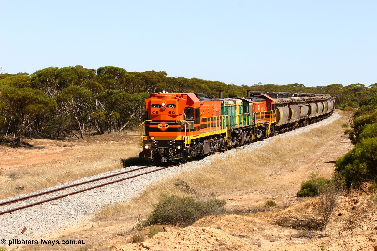 060111 2318
Nantuma, Clyde Engineering built EMD G12C model loco 1203 serial 65-427 leads two ALCo units 850 and 905 as they round the bend just north of the old station site at the 183 km. Their next shunt will be Warramboo. 11th January 2006.
Keywords: 1200-class;1203;Clyde-Engineering-Granville-NSW;EMD;G12C;65-427;A-class;A1513;