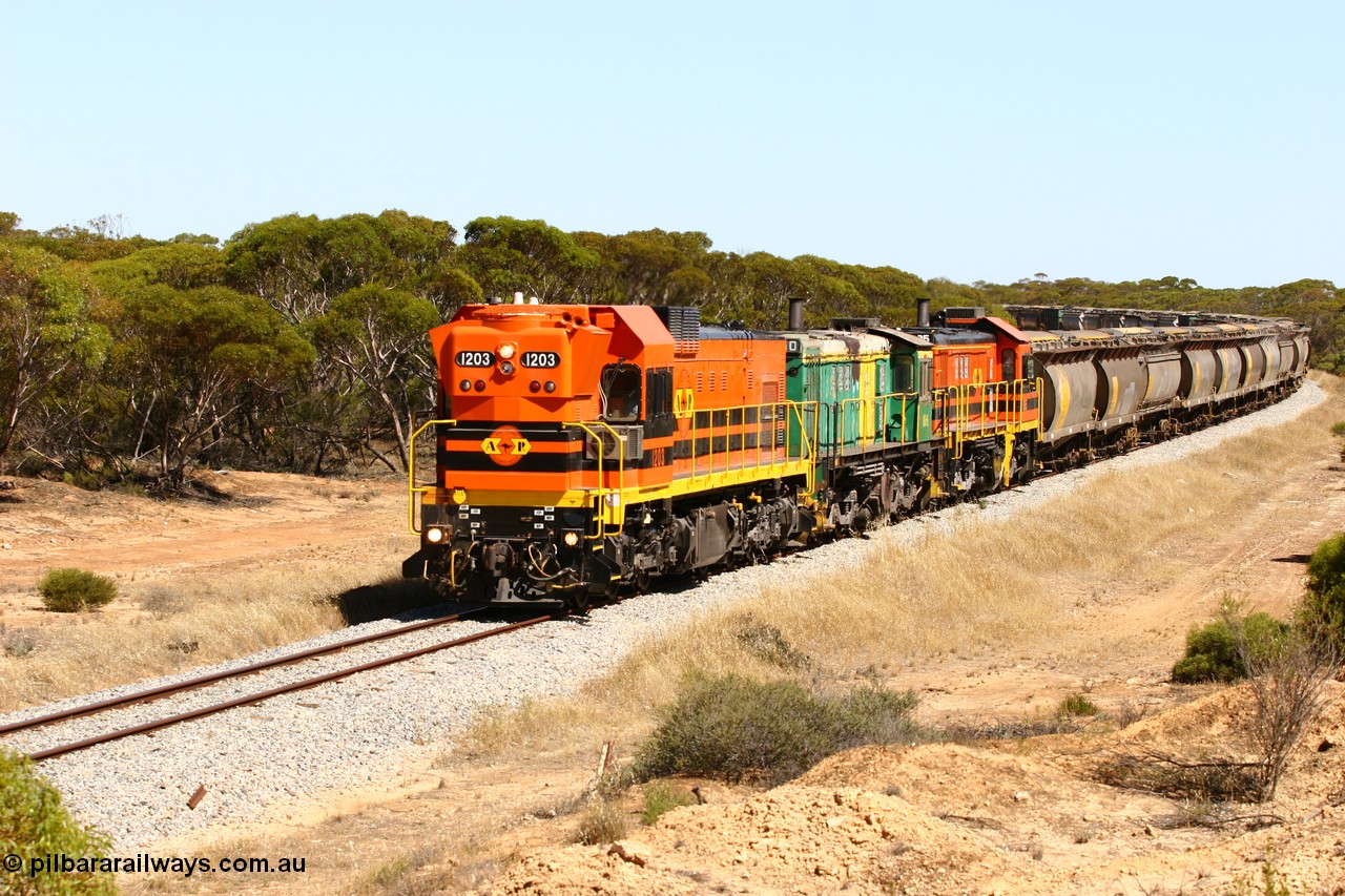060111 2320
Nantuma, Clyde Engineering built EMD G12C model loco 1203 serial 65-427 leads two ALCo units 850 and 905 as they round the bend just north of the old station site at the 183 km. Their next shunt will be Warramboo. 11th January 2006.
Keywords: 1200-class;1203;Clyde-Engineering-Granville-NSW;EMD;G12C;65-427;A-class;A1513;