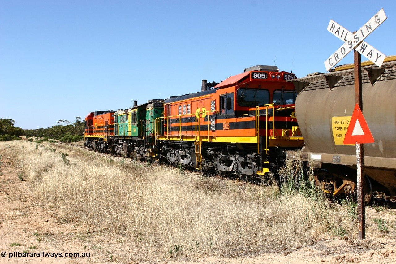 060111 2338
Warramboo, ARG 900 class unit 905, originally built by AE Goodwin as 830 class unit 836 serial 83727, converted to DA class DA 6 by Australian National at Port Augusta workshops for driver only operation in 1996. Trailing unit in a north bound grain train as it crosses Kimba Road grade crossing. 11th January 2006.
Keywords: 900-class;905;83727;830-class;836;AE-Goodwin;ALCo;DL531;DA-class;DA6;