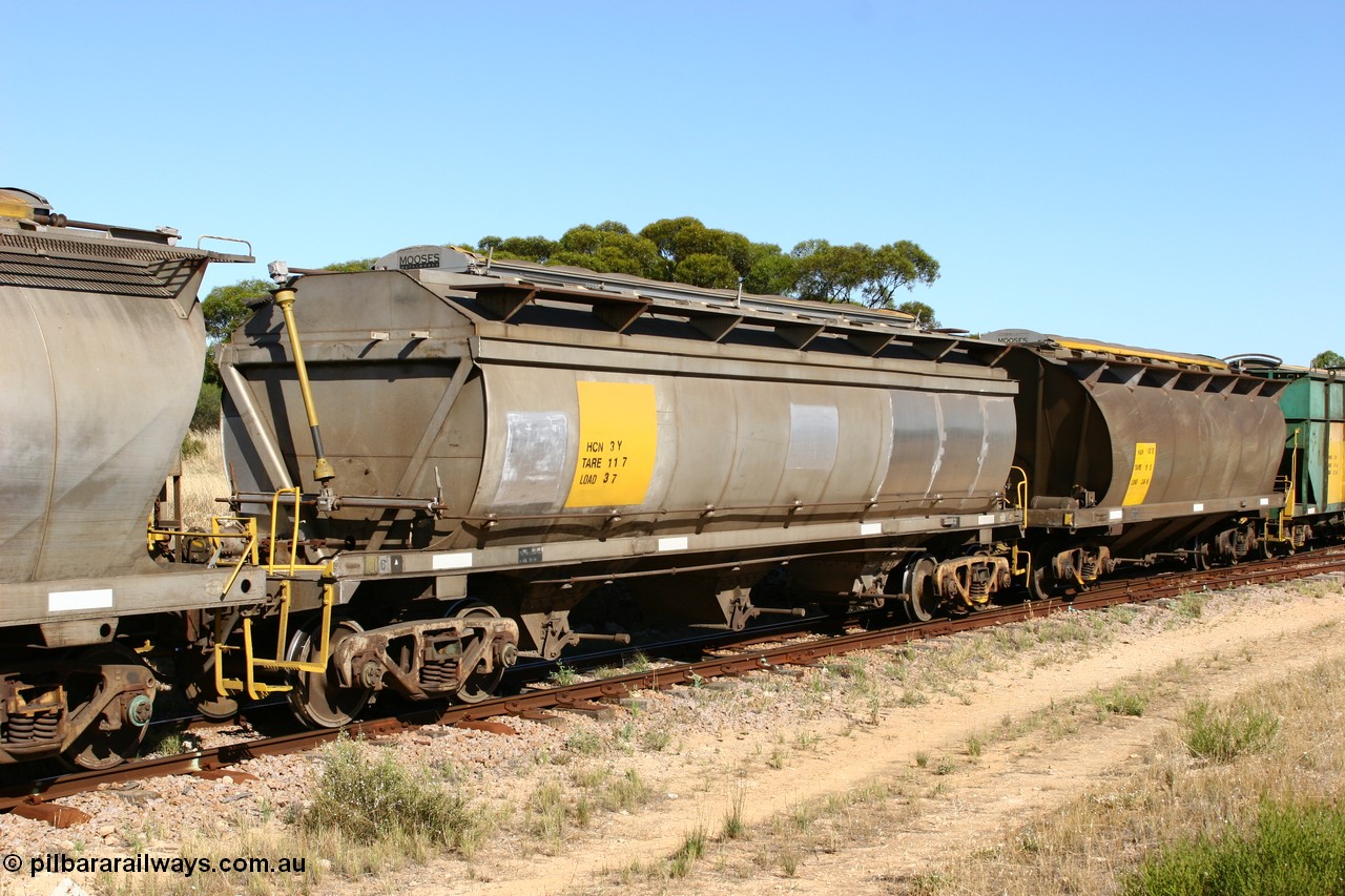 060111 2351
Kyancutta, HCN type bogie wheat waggon HCN 3 shows signs of new panel work, was modified at Islington Workshops in 1978-80 and started life as a Tulloch built NHB type iron ore hopper for the CR on the North Australia Railway in 1968-69, and an SAR built HAN type HAN 13 part of an empty grain train. 11th January 2006.
Keywords: HCN-type;HCN3;SAR-Islington-WS;rebuild;Tulloch-Ltd-NSW;NHB-type;NHB1595;