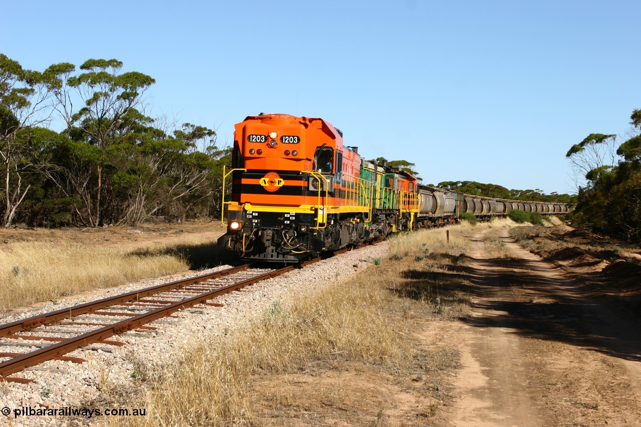 060111 2392
Wannamana, ARG 1200 class unit 1203, a Clyde Engineering EMD model G12C serial 65-427, one of fourteen originally built between 1960-65 for WAGR as their A class A 1513, fitted with dynamic brakes and financed by Western Mining Corporation, started working on the Eyre Peninsula in November 2004 here leading a north bound empty grain train heading to Wudinna. Wannamana was located at the 210 km and opened in January 1927, this scene is some 79 years later. The siding was closed in April 1957. 11th January 2006.
Keywords: 1200-class;1203;Clyde-Engineering-Granville-NSW;EMD;G12C;65-427;A-class;A1513;
