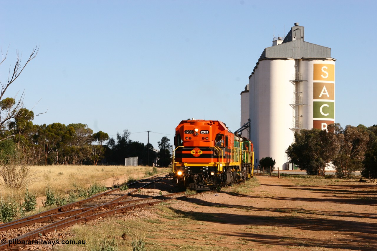 060111 2403
Wudinna, ARG 1200 class unit 1203, a Clyde Engineering EMD model G12C serial 65-427, one of fourteen originally built between 1960-65 for WAGR as their A class A 1513, fitted with dynamic brakes and financed by Western Mining Corporation, started working on the Eyre Peninsula in November 2004, shunts through the yard.
Keywords: 1200-class;1203;Clyde-Engineering-Granville-NSW;EMD;G12C;65-427;A-class;A1513;
