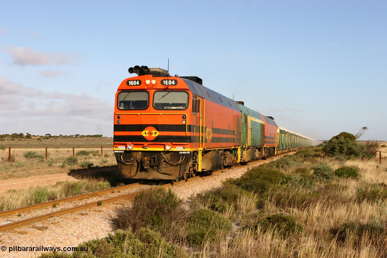 060113 2420
Ceduna, loaded gypsum train 6DD2 stirs up the dust behind the triple Clyde Engineering EMD JL22C model 1600 / NJ class combination of 1604 serial 71-731 and originally NJ 4, NJ 3 serial 71-730 and 1601 serial 71-728 class leader NJ 1, all three units started on the Central Australia Railway in 1971 and were transferred to the Eyre Peninsula in 1981. 08:10 AM on the Friday the 13th January 2006.
Keywords: 1600-class;1604;Clyde-Engineering-Granville-NSW;EMD;JL22C;71-731;NJ-class;NJ4;