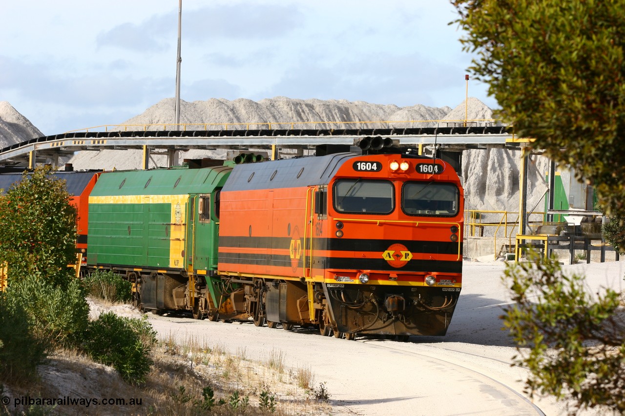 060113 2431
Thevenard, at the Gypsum Resources Australian (GRA) gypsum unloading site, 1604 leads a triple consist of Clyde Engineering EMD JL22C model 1600 / NJ class combination of 1604 serial 71-731 and originally NJ 4, NJ 3 serial 71-730 and 1601 serial 71-728 class leader NJ 1, all three units started on the Central Australia Railway in 1971 and were transferred to the Eyre Peninsula in 1981. 1604 and 1601 both renumbered in 2004. Friday 13th January 2006.
Keywords: 1600-class;1604;Clyde-Engineering-Granville-NSW;EMD;JL22C;71-731;NJ-class;NJ4;
