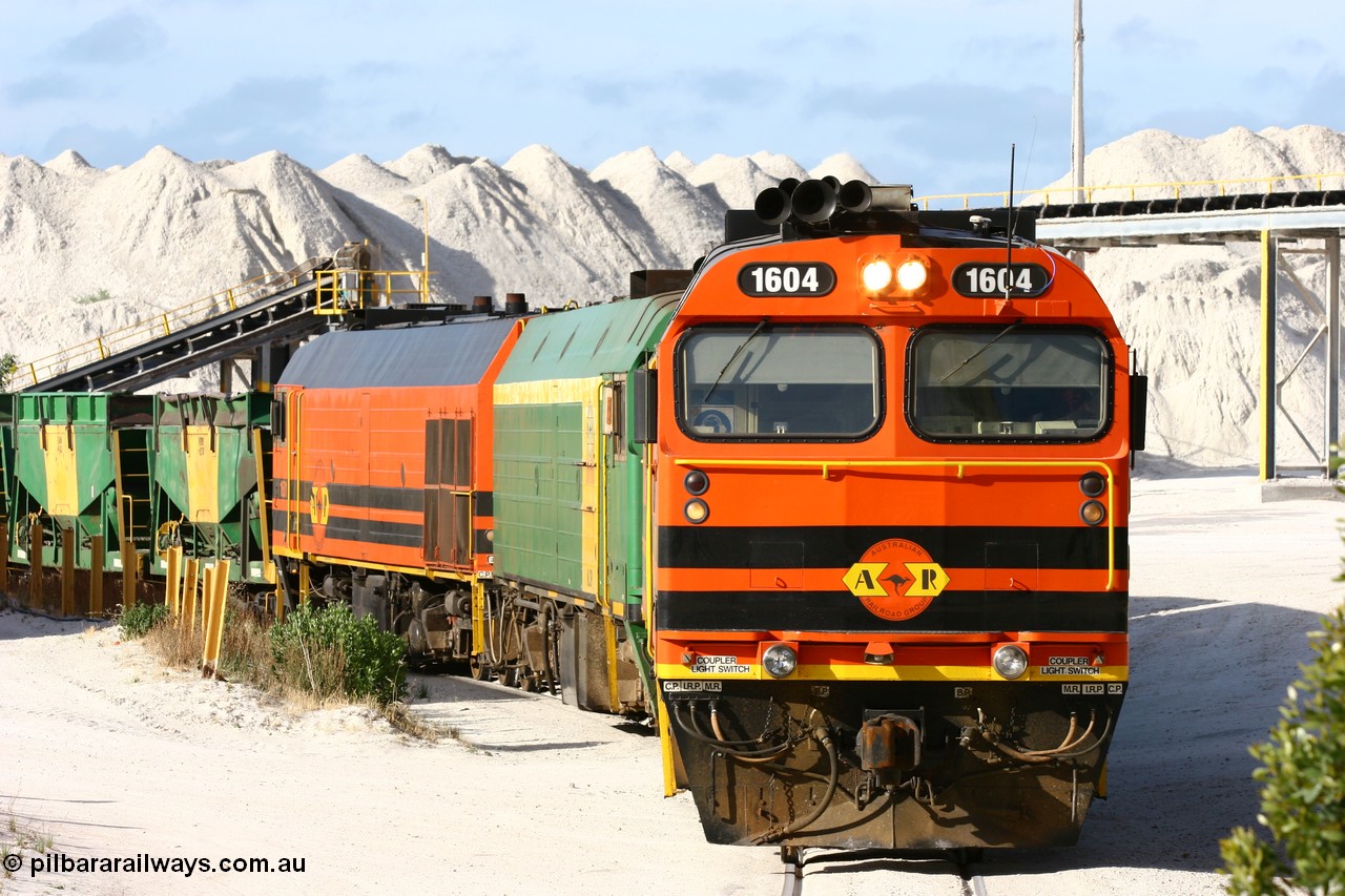 060113 2434
Thevenard, at the Gypsum Resources Australian (GRA) gypsum unloading site, 1604 leads a triple consist of Clyde Engineering EMD JL22C model 1600 / NJ class combination of 1604 serial 71-731 and originally NJ 4, NJ 3 serial 71-730 and 1601 serial 71-728 class leader NJ 1, all three units started on the Central Australia Railway in 1971 and were transferred to the Eyre Peninsula in 1981. 1604 and 1601 both renumbered in 2004. Friday 13th January 2006.
Keywords: 1600-class;1604;Clyde-Engineering-Granville-NSW;EMD;JL22C;71-731;NJ-class;NJ4;