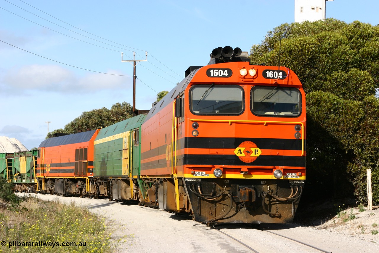 060113 2436
Thevenard, at the Gypsum Resources Australian (GRA) gypsum unloading site, 1604 leads a triple consist of Clyde Engineering EMD JL22C model 1600 / NJ class combination of 1604 serial 71-731 and originally NJ 4, NJ 3 serial 71-730 and 1601 serial 71-728 class leader NJ 1, all three units started on the Central Australia Railway in 1971 and were transferred to the Eyre Peninsula in 1981. 1604 and 1601 both renumbered in 2004. Friday 13th January 2006.
Keywords: 1600-class;1604;Clyde-Engineering-Granville-NSW;EMD;JL22C;71-731;NJ-class;NJ4;