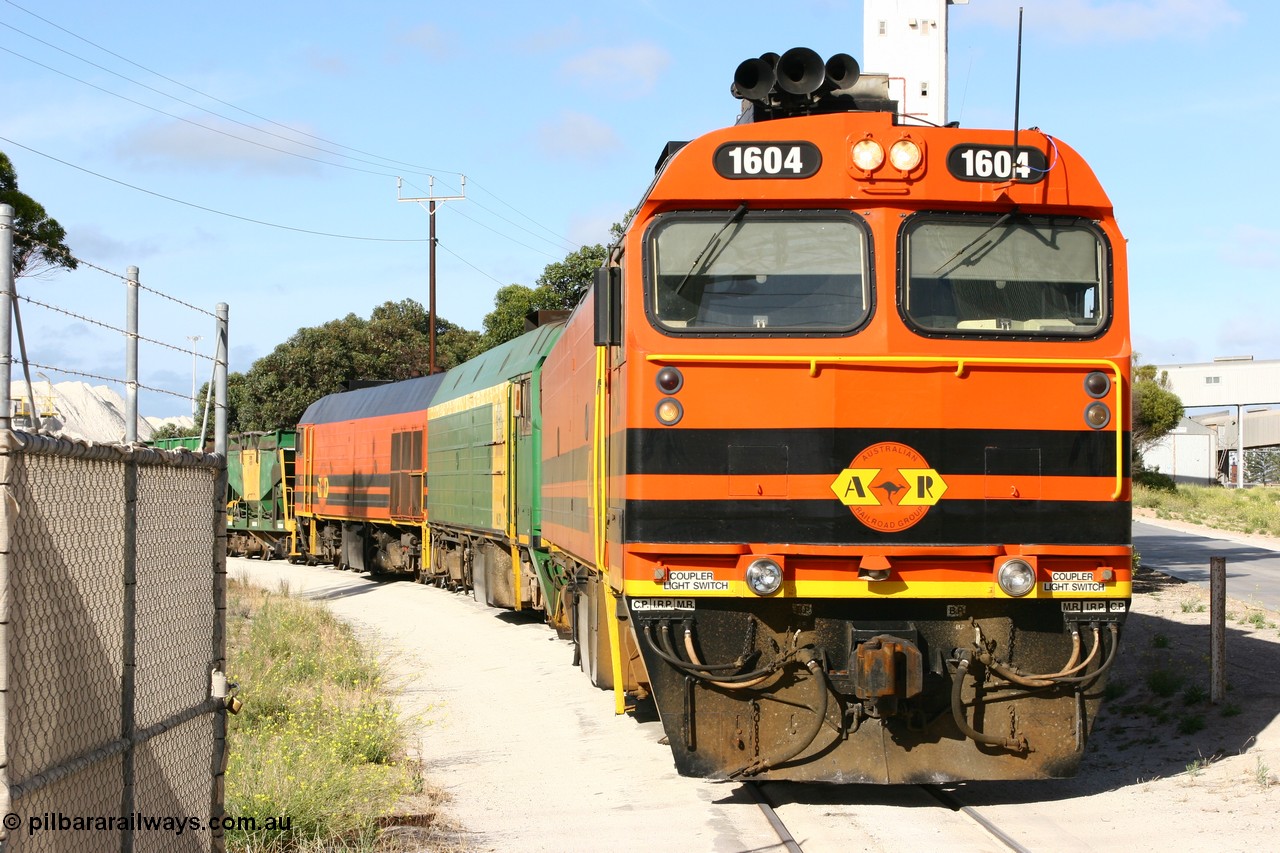 060113 2437
Thevenard, at the Gypsum Resources Australian (GRA) gypsum unloading site, 1604 leads a triple consist of Clyde Engineering EMD JL22C model 1600 / NJ class combination of 1604 serial 71-731 and originally NJ 4, NJ 3 serial 71-730 and 1601 serial 71-728 class leader NJ 1, all three units started on the Central Australia Railway in 1971 and were transferred to the Eyre Peninsula in 1981. 1604 and 1601 both renumbered in 2004. Friday 13th January 2006.
Keywords: 1600-class;1604;Clyde-Engineering-Granville-NSW;EMD;JL22C;71-731;NJ-class;NJ4;