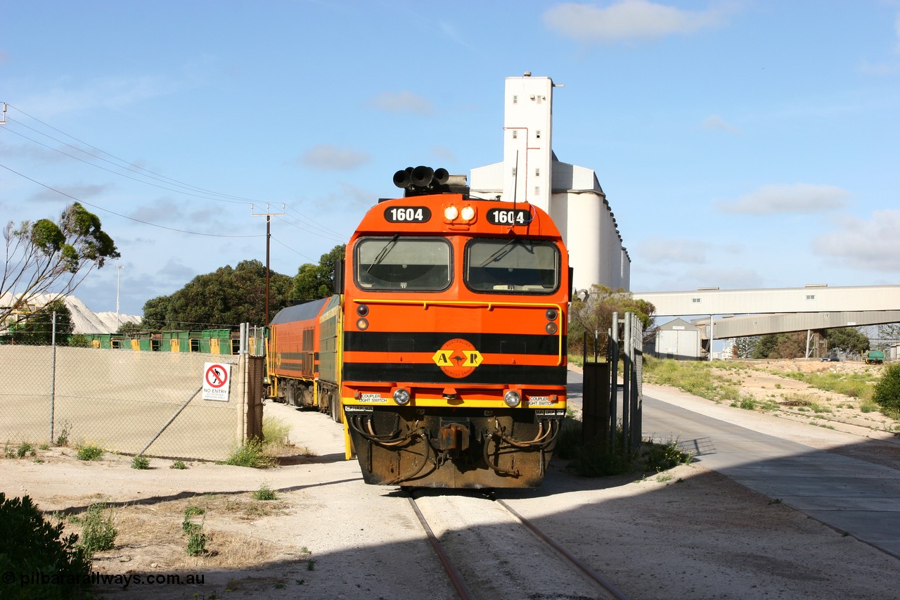 060113 2440
Thevenard, at the Gypsum Resources Australian (GRA) gypsum unloading site, 1604 leads a triple consist of Clyde Engineering EMD JL22C model 1600 / NJ class combination of 1604 serial 71-731 and originally NJ 4, NJ 3 serial 71-730 and 1601 serial 71-728 class leader NJ 1, all three units started on the Central Australia Railway in 1971 and were transferred to the Eyre Peninsula in 1981. 1604 and 1601 both renumbered in 2004. Friday 13th January 2006.
Keywords: 1600-class;1604;Clyde-Engineering-Granville-NSW;EMD;JL22C;71-731;NJ-class;NJ4;