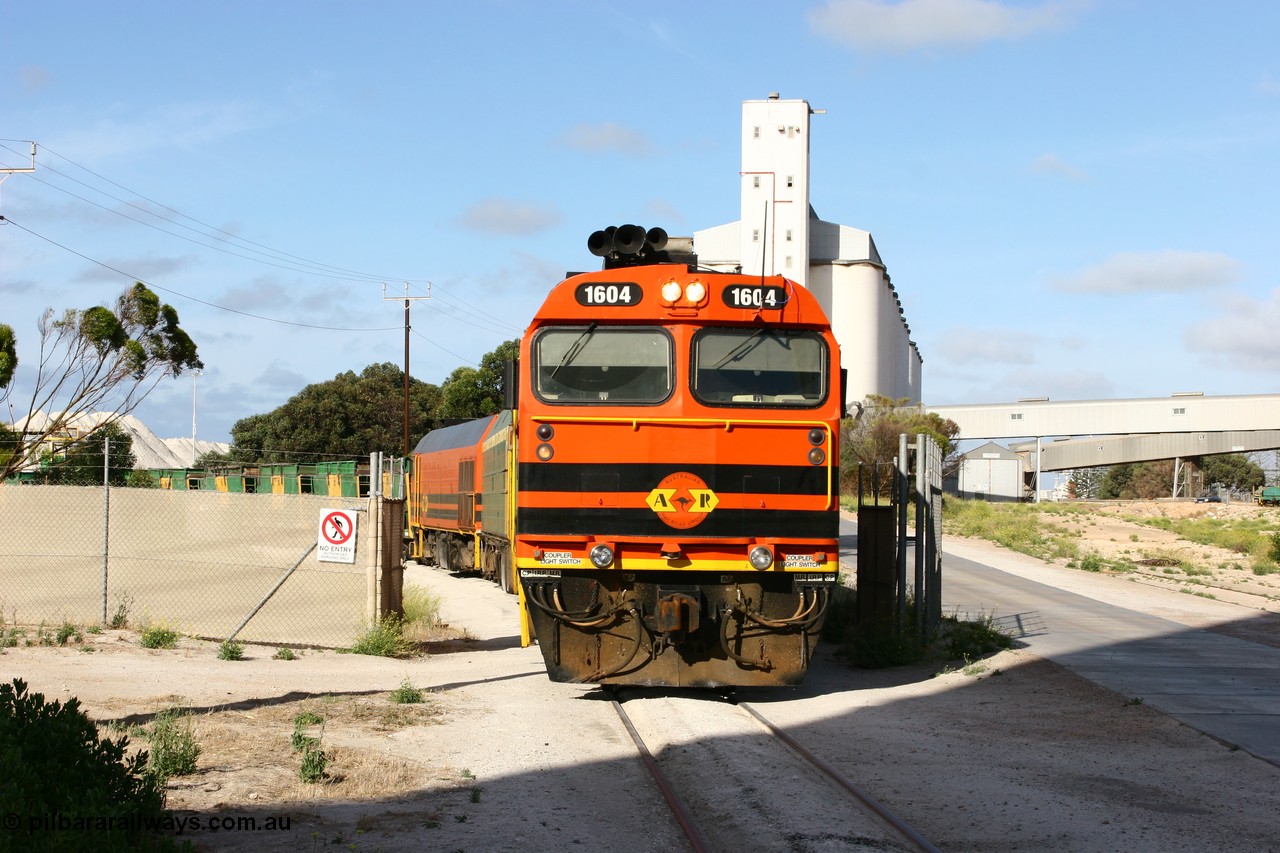 060113 2441
Thevenard, at the Gypsum Resources Australian (GRA) gypsum unloading site, 1604 leads a triple consist of Clyde Engineering EMD JL22C model 1600 / NJ class combination of 1604 serial 71-731 and originally NJ 4, NJ 3 serial 71-730 and 1601 serial 71-728 class leader NJ 1, all three units started on the Central Australia Railway in 1971 and were transferred to the Eyre Peninsula in 1981. 1604 and 1601 both renumbered in 2004. Friday 13th January 2006.
Keywords: 1600-class;1604;Clyde-Engineering-Granville-NSW;EMD;JL22C;71-731;NJ-class;NJ4;