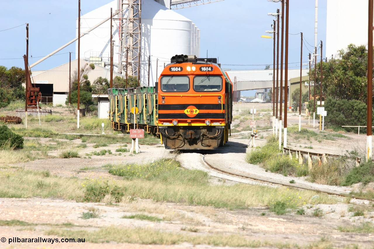 060113 2465
Thevenard, narrow gauge loco 1604 departs the yard with empty train 6DD3, 1604 leads a triple consist of Clyde Engineering built EMD JL22C model 1600 / NJ class combination of 1604 serial 71-731 and originally NJ 4, NJ 3 serial 71-730 and 1601 serial 71-728 the original class leader NJ 1, all three units started on the Central Australia Railway in 1971 and were transferred to the Eyre Peninsula in 1981. 1604 and 1601 both renumbered in 2004. 13th January 2006.
Keywords: 1600-class;1604;Clyde-Engineering-Granville-NSW;EMD;JL22C;71-731;NJ-class;NJ4;
