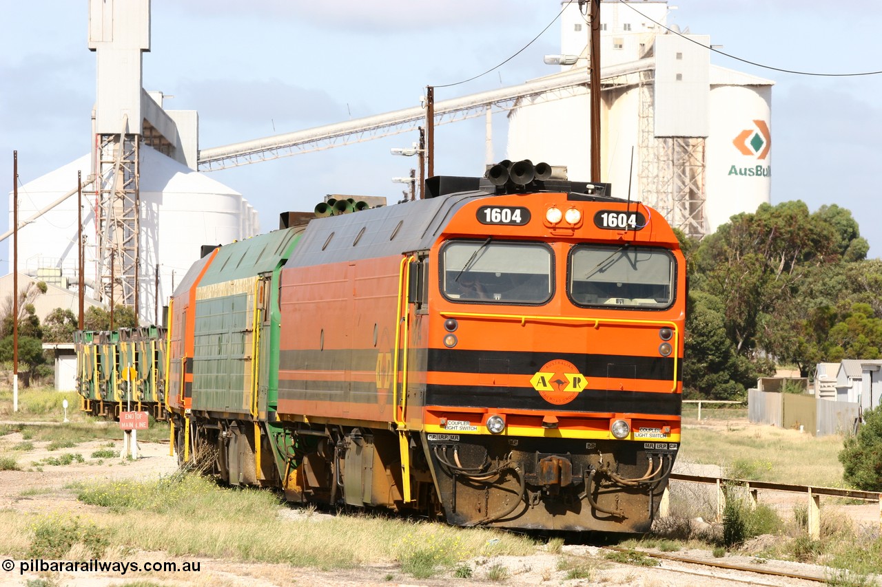 060113 2469
Thevenard, narrow gauge loco 1604 departs the yard with empty train 6DD3, 1604 leads a triple consist of Clyde Engineering built EMD JL22C model 1600 / NJ class combination of 1604 serial 71-731 and originally NJ 4, NJ 3 serial 71-730 and 1601 serial 71-728 the original class leader NJ 1, all three units started on the Central Australia Railway in 1971 and were transferred to the Eyre Peninsula in 1981. 1604 and 1601 both renumbered in 2004. 13th January 2006.
Keywords: 1600-class;1604;Clyde-Engineering-Granville-NSW;EMD;JL22C;71-731;NJ-class;NJ4;