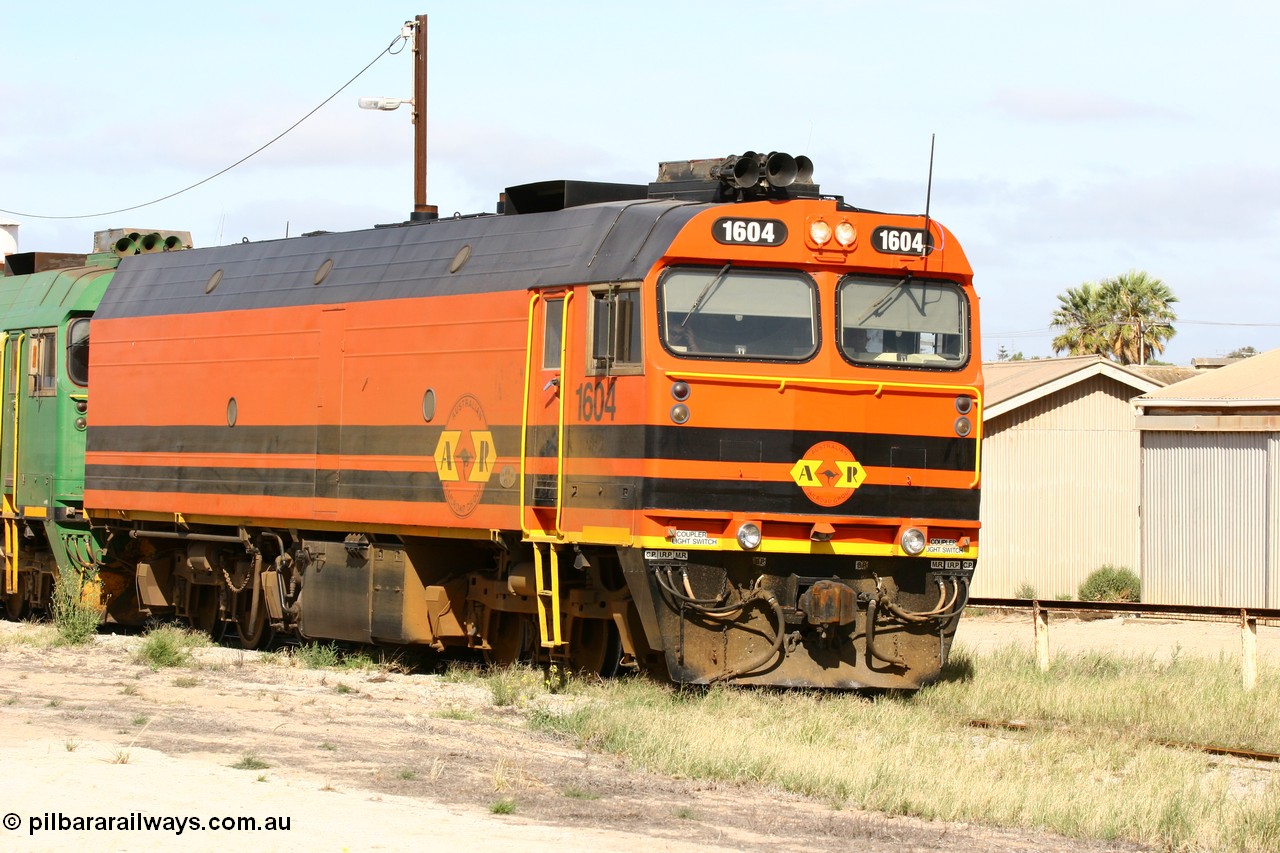 060113 2474
Thevenard, narrow gauge loco 1604 departs the yard with empty train 6DD3, 1604 leads a triple consist of Clyde Engineering built EMD JL22C model 1600 / NJ class combination of 1604 serial 71-731 and originally NJ 4, NJ 3 serial 71-730 and 1601 serial 71-728 the original class leader NJ 1, all three units started on the Central Australia Railway in 1971 and were transferred to the Eyre Peninsula in 1981. 1604 and 1601 both renumbered in 2004. 13th January 2006.
Keywords: 1600-class;1604;Clyde-Engineering-Granville-NSW;EMD;JL22C;71-731;NJ-class;NJ4;