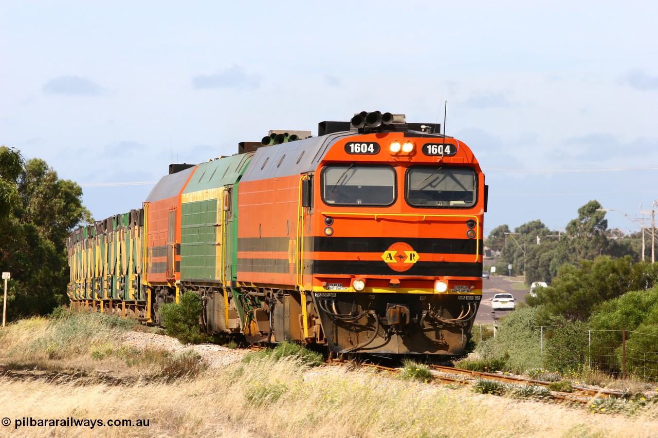 060113 2475
Thevenard, empty gypsum train 6DD3 lead by narrow gauge loco 1604 with a triple consist of Clyde Engineering built EMD JL22C model 1600 / NJ class combination of 1604 serial 71-731 and originally NJ 4, NJ 3 serial 71-730 and 1601 serial 71-728 the original class leader NJ 1, all three units started on the Central Australia Railway in 1971 and were transferred to the Eyre Peninsula in 1981. 1604 and 1601 both renumbered in 2004 [url=https://goo.gl/maps/3dLGGj7AFkE82J4A8]GeoData[/url]. 13th January 2006.
Keywords: 1600-class;1604;Clyde-Engineering-Granville-NSW;EMD;JL22C;71-731;NJ-class;NJ4;