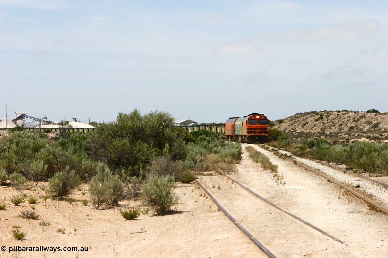 060113 2482
Thevenard, empty gypsum train 6DD3 lead by narrow gauge loco 1604 with a triple consist of Clyde Engineering built EMD JL22C model 1600 / NJ class combination of 1604 serial 71-731 and originally NJ 4, NJ 3 serial 71-730 and 1601 serial 71-728 the original class leader NJ 1, all three units started on the Central Australia Railway in 1971 and were transferred to the Eyre Peninsula in 1981. 1604 and 1601 both renumbered in 2004 [url=https://goo.gl/maps/3dLGGj7AFkE82J4A8]GeoData[/url]. 13th January 2006.
Keywords: 1600-class;1604;Clyde-Engineering-Granville-NSW;EMD;JL22C;71-731;NJ-class;NJ4;