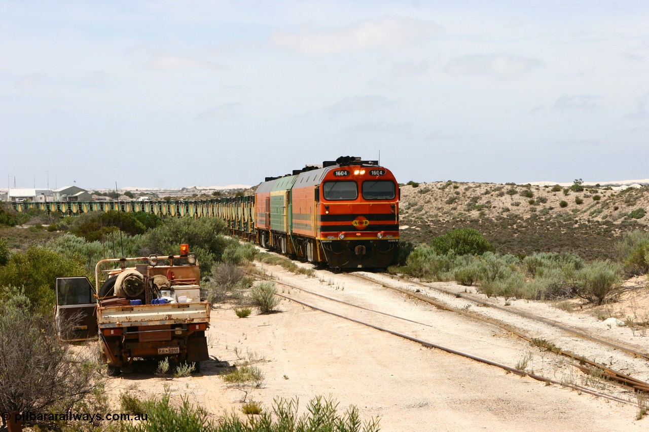 060113 2484
Kevin, ARG 1600 class narrow gauge loco 1604 a Clyde Engineering built EMD model JL22C serial 71-731, originally built for the Central Australia Railway in 1971, transferred to the Eyre Peninsula in 1981 arrives with empty gypsum train 6DD3. 13th January 2006.
Keywords: 1600-class;1604;Clyde-Engineering-Granville-NSW;EMD;JL22C;71-731;NJ-class;NJ4;