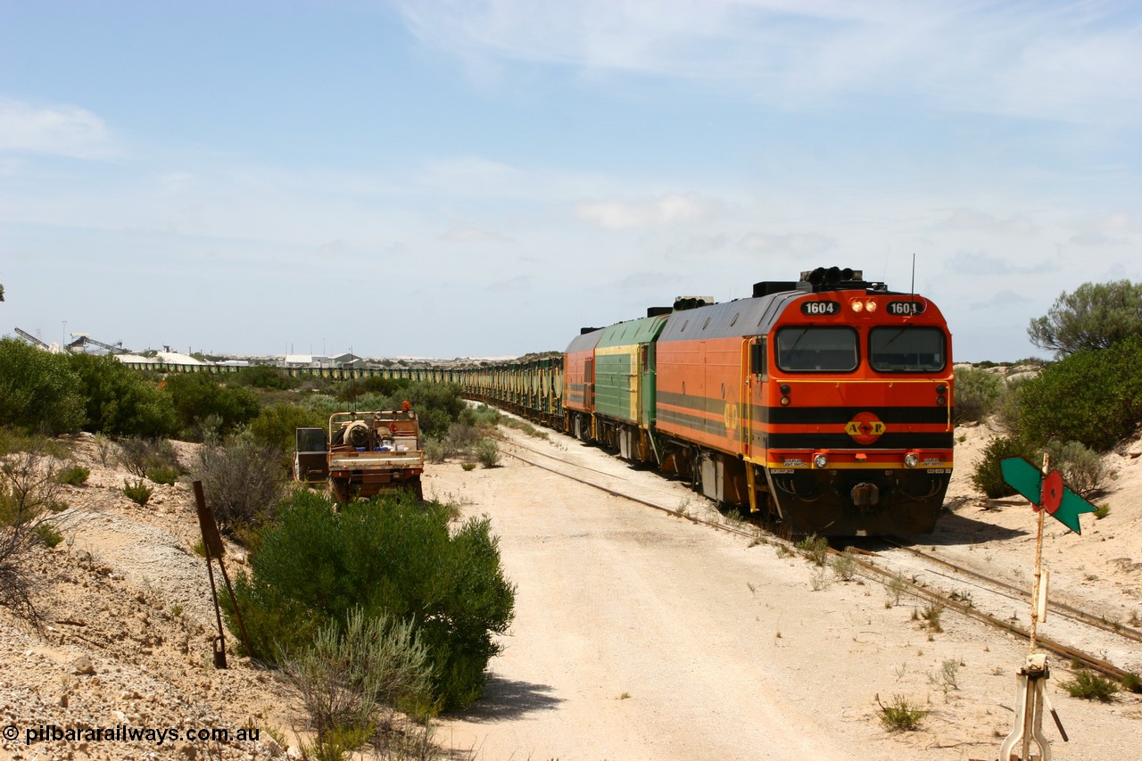 060113 2487
Kevin, ARG 1600 class narrow gauge loco 1604 a Clyde Engineering built EMD model JL22C serial 71-731, originally built for the Central Australia Railway in 1971, transferred to the Eyre Peninsula in 1981 arrives with empty gypsum train 6DD3. 13th January 2006.
Keywords: 1600-class;1604;Clyde-Engineering-Granville-NSW;EMD;JL22C;71-731;NJ-class;NJ4;