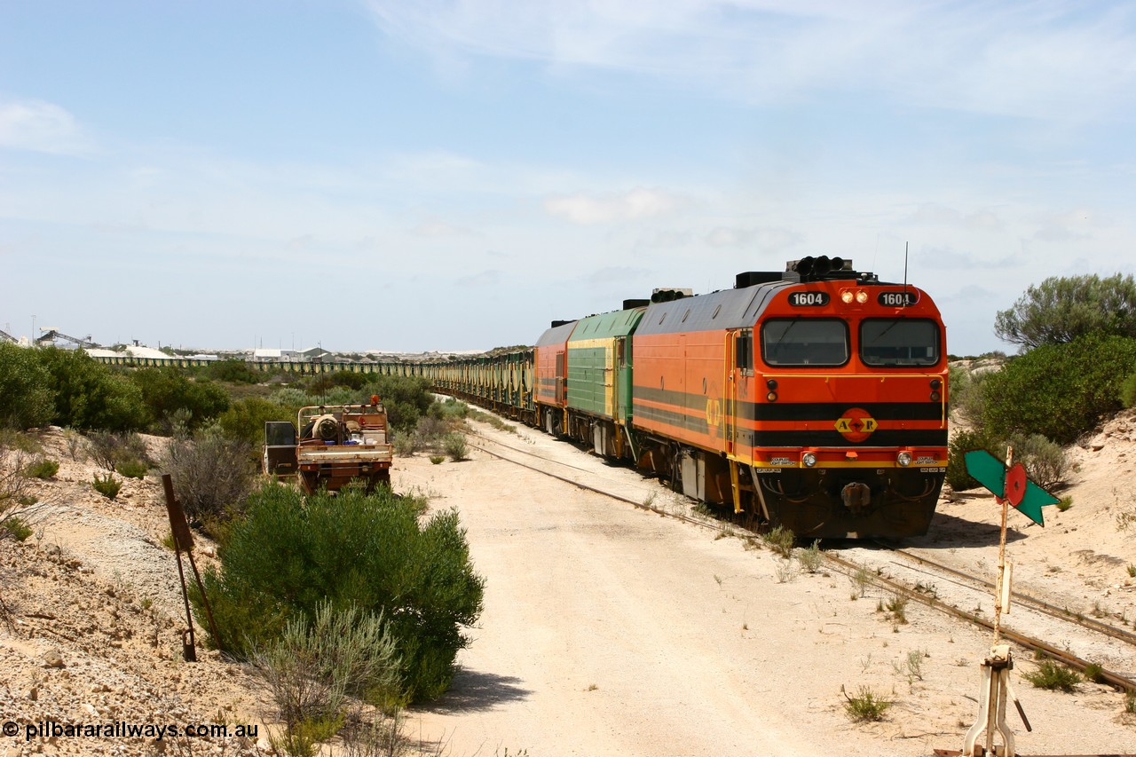 060113 2488
Kevin, ARG 1600 class narrow gauge loco 1604 a Clyde Engineering built EMD model JL22C serial 71-731, originally built for the Central Australia Railway in 1971, transferred to the Eyre Peninsula in 1981 arrives with empty gypsum train 6DD3. 13th January 2006.
Keywords: 1600-class;1604;Clyde-Engineering-Granville-NSW;EMD;JL22C;71-731;NJ-class;NJ4;