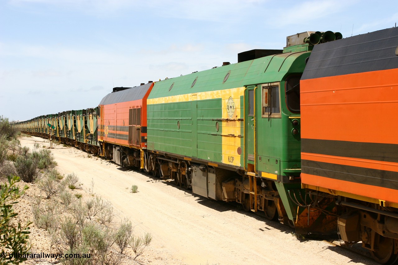 060113 2499
Kevin, empty train 6DD3 on the [url=https://goo.gl/maps/jZAuZ]stub of the now closed line to Penong[/url] shunts back onto the triangle leg to reverse the train prior to loading. 13th January 2006.
Keywords: NJ-class;NJ3;Clyde-Engineering-Granville-NSW;EMD;JL22C;71-730;