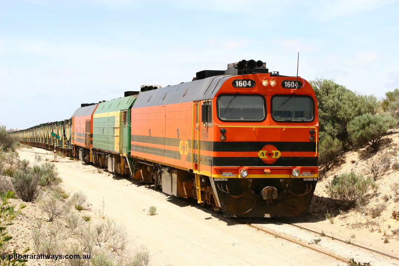 060113 2501
Kevin, empty train 6DD3 on the [url=https://goo.gl/maps/jZAuZ]stub of the now closed line to Penong[/url] shunts back onto the triangle leg to reverse the train prior to loading. 13th January 2006.
Keywords: 1600-class;1604;Clyde-Engineering-Granville-NSW;EMD;JL22C;71-731;NJ-class;NJ4;