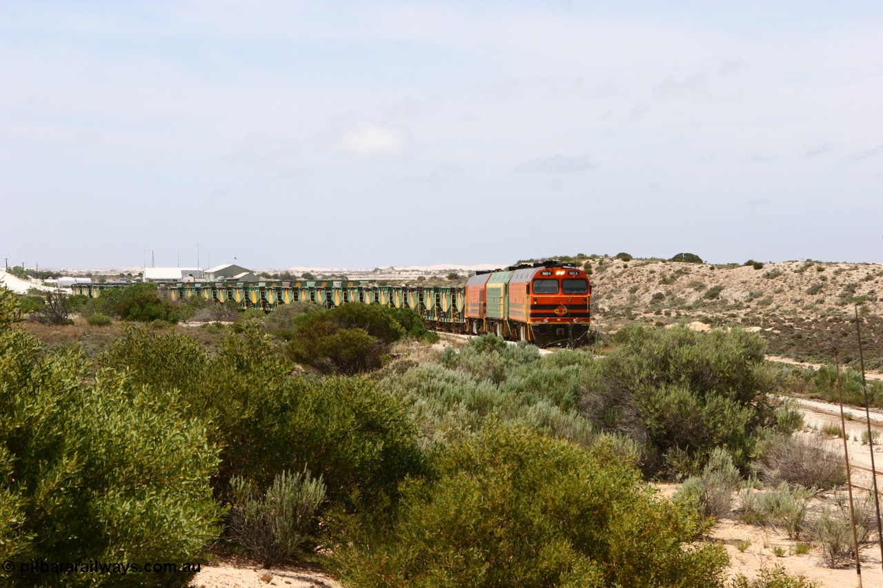060113 2505
Kevin, elevated view with the goods siding visible besides narrow gauge loco 1604 as it leads NJ 3 and 1601 with empty train 6DD3 as they reverse around the triangle to position the train for loading back on the mainline to Thevenard. 13th January 2006.
Keywords: 1600-class;1604;Clyde-Engineering-Granville-NSW;EMD;JL22C;71-731;NJ-class;NJ4;